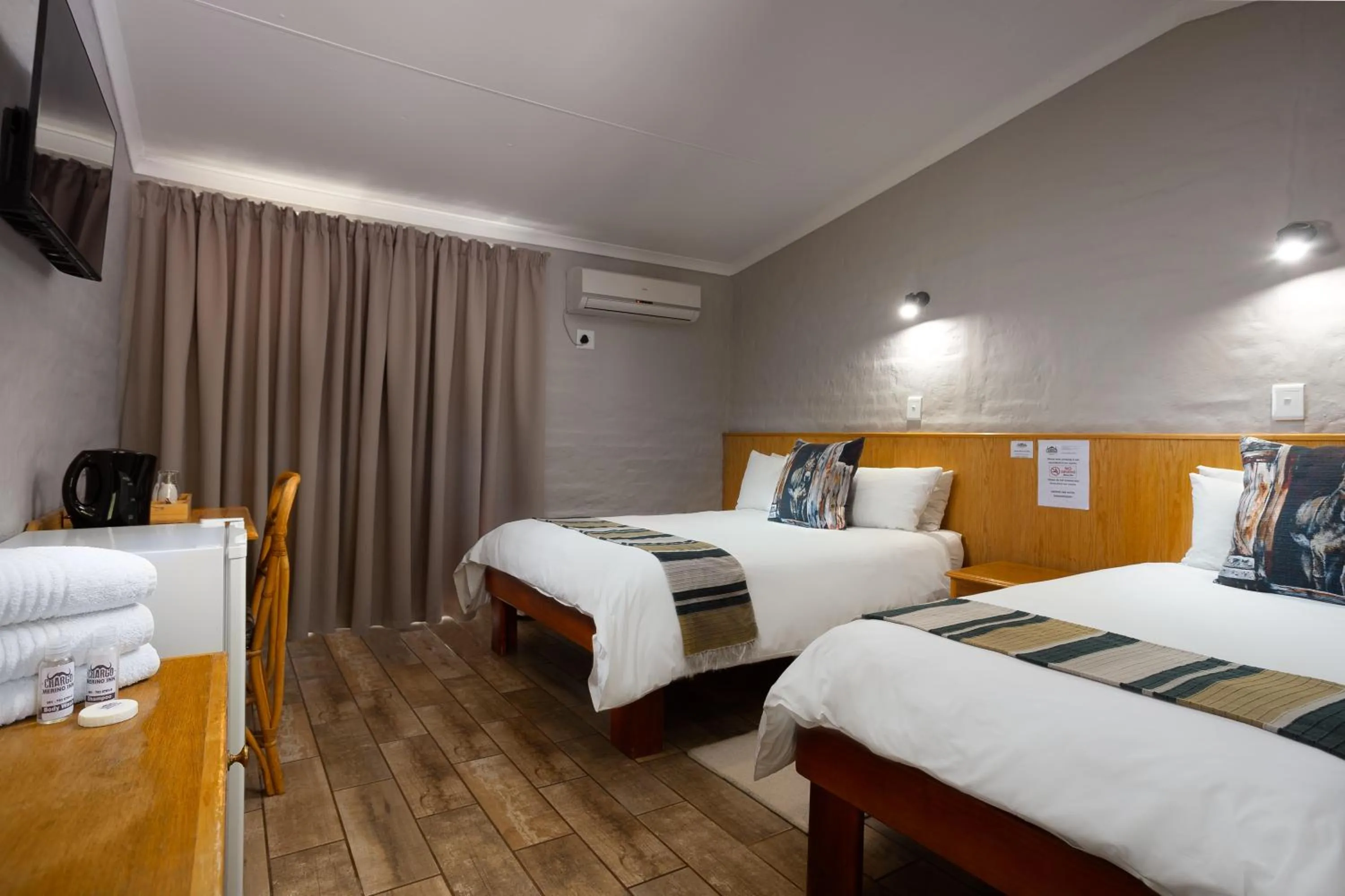 Bed in Merino Inn Hotel