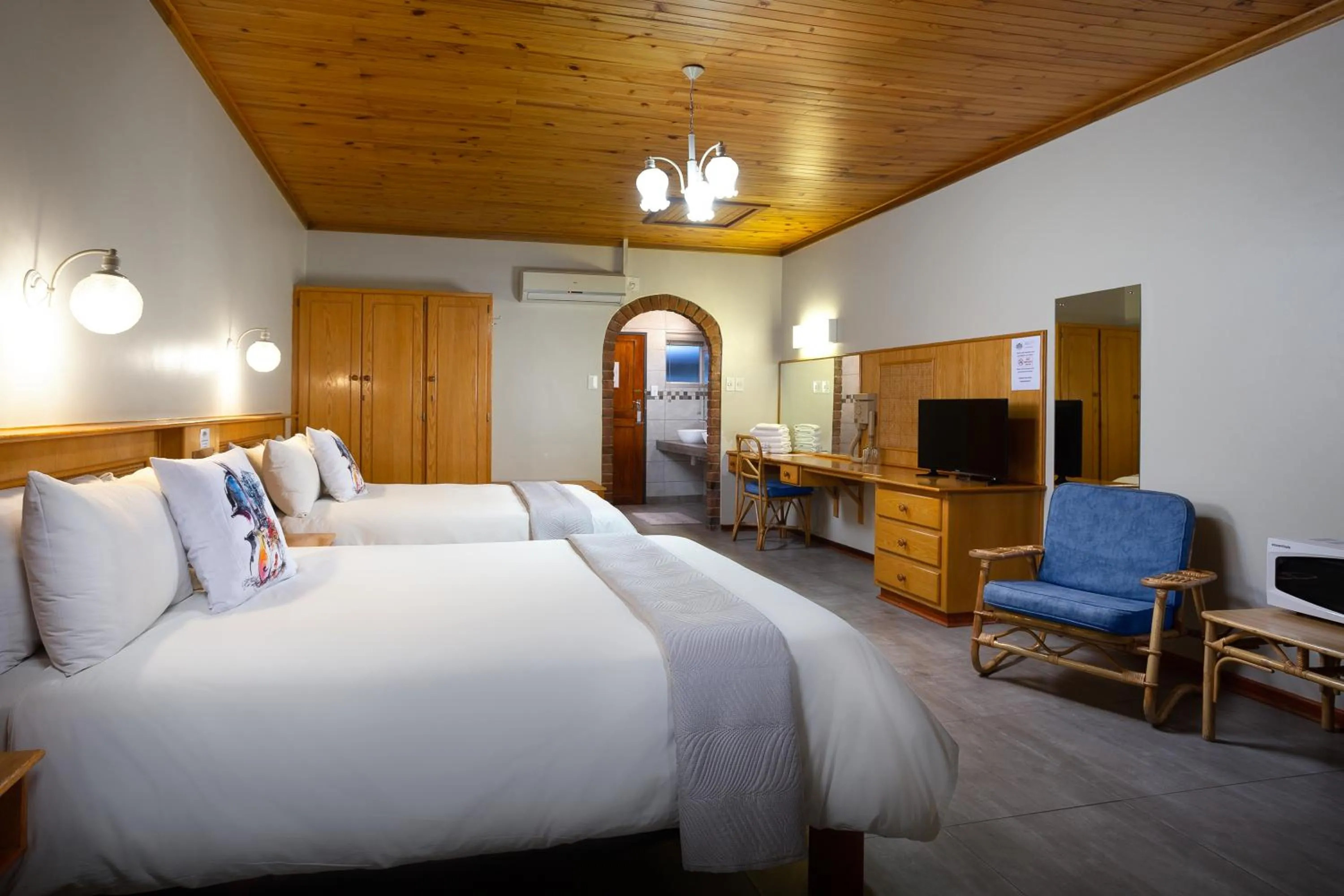 Bed in Merino Inn Hotel