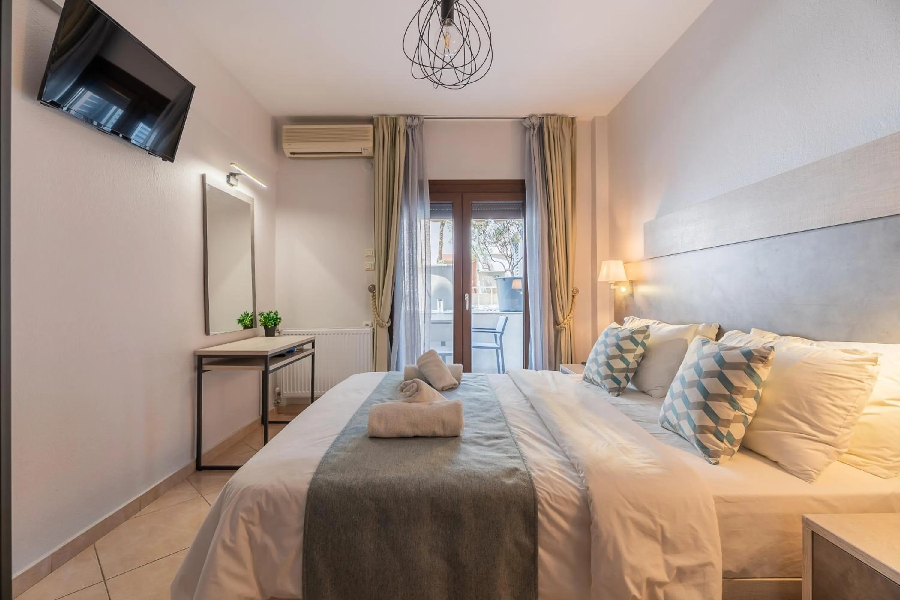 Bed in Meliton Inn Hotel & Suites by the beach