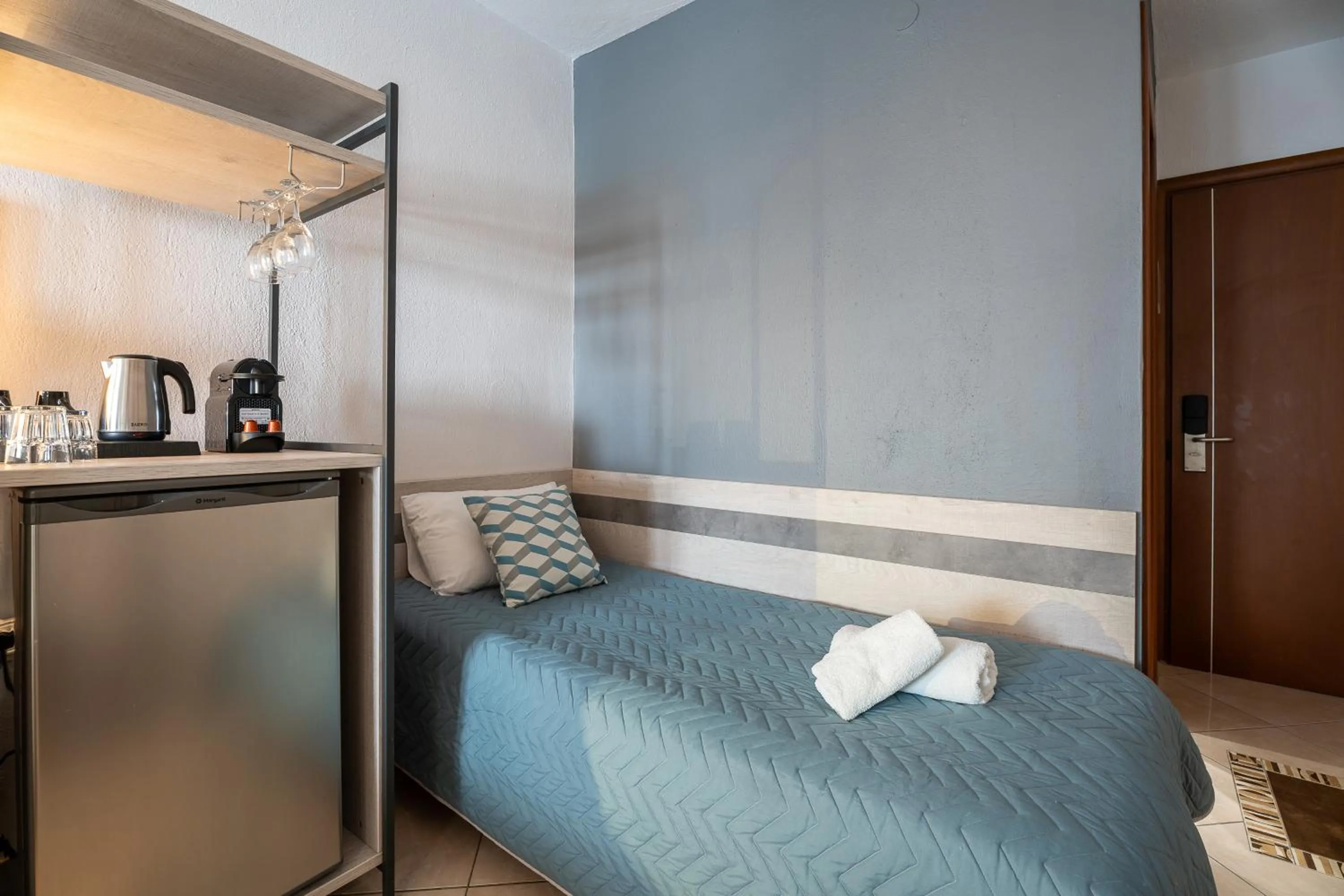 Bed in Meliton Inn Hotel & Suites by the beach