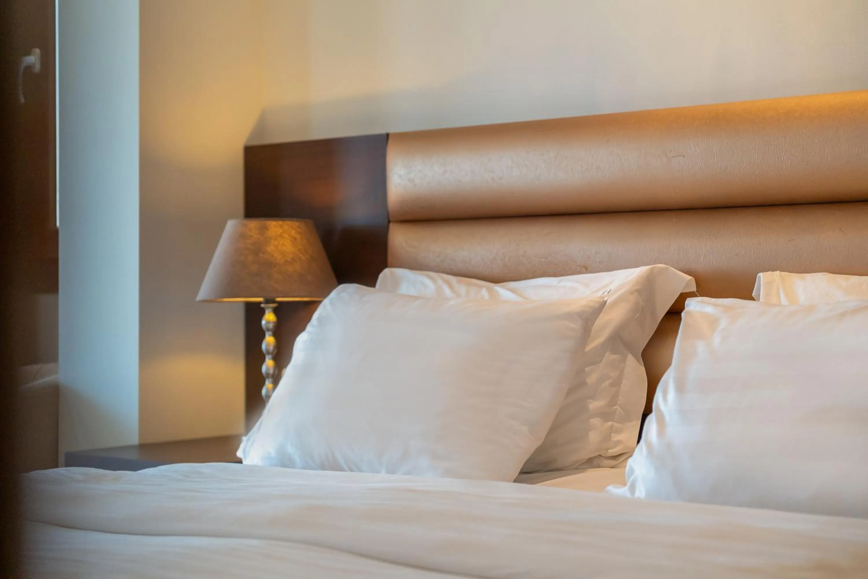 Bed in Meliton Inn Hotel & Suites by the beach