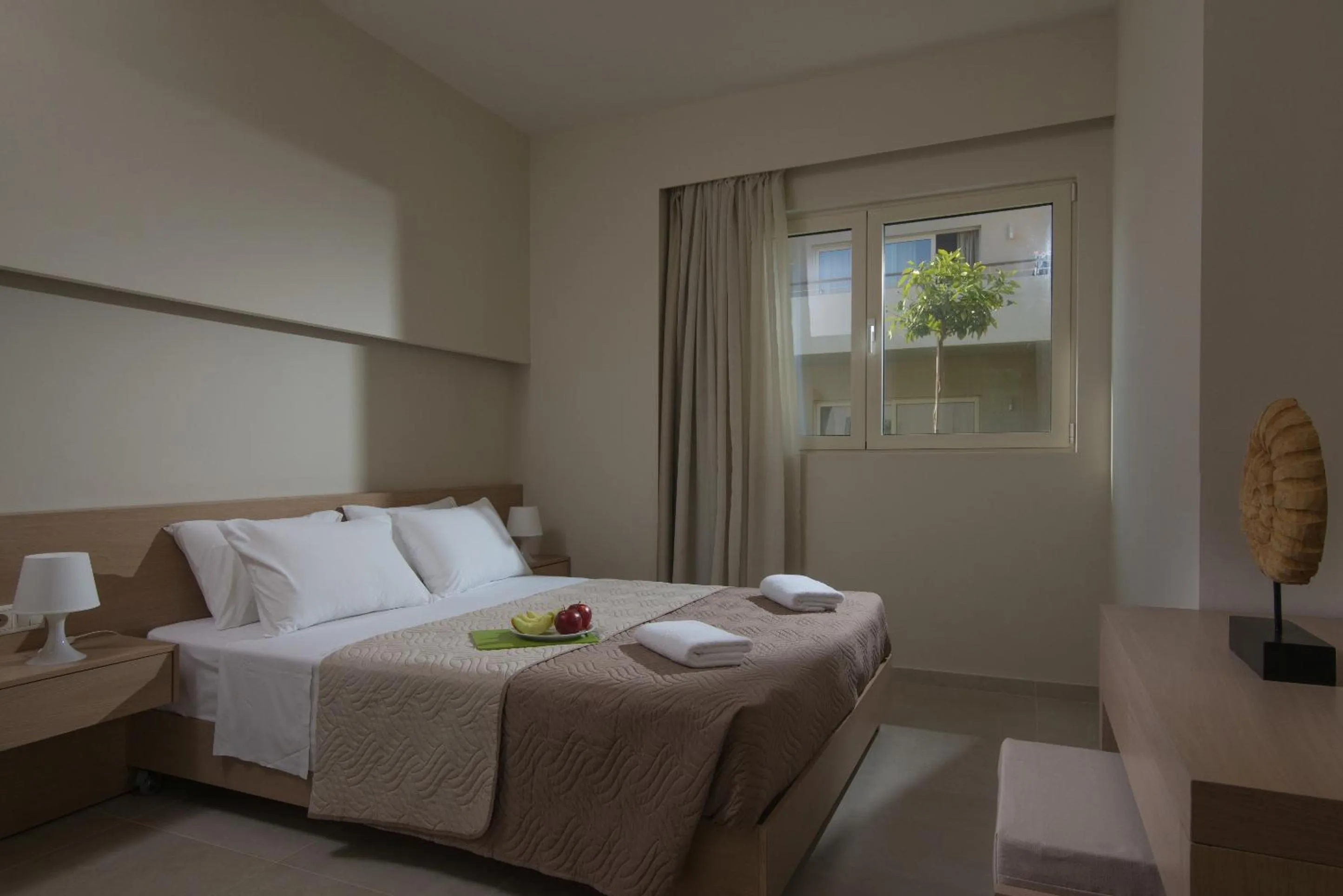 Bed in Ourania Apartments Hotel