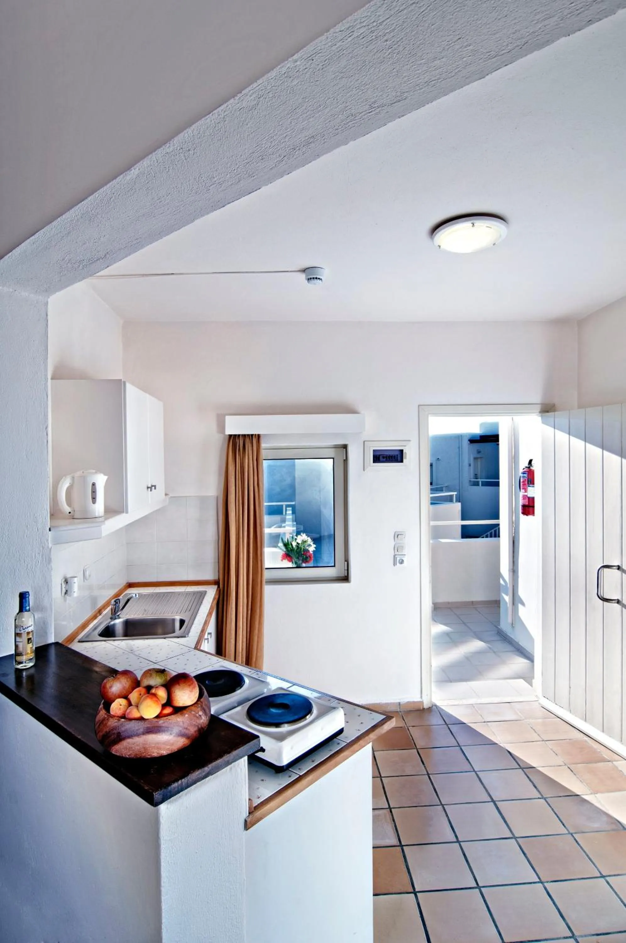 Kitchen or kitchenette in Ourania Apartments Hotel