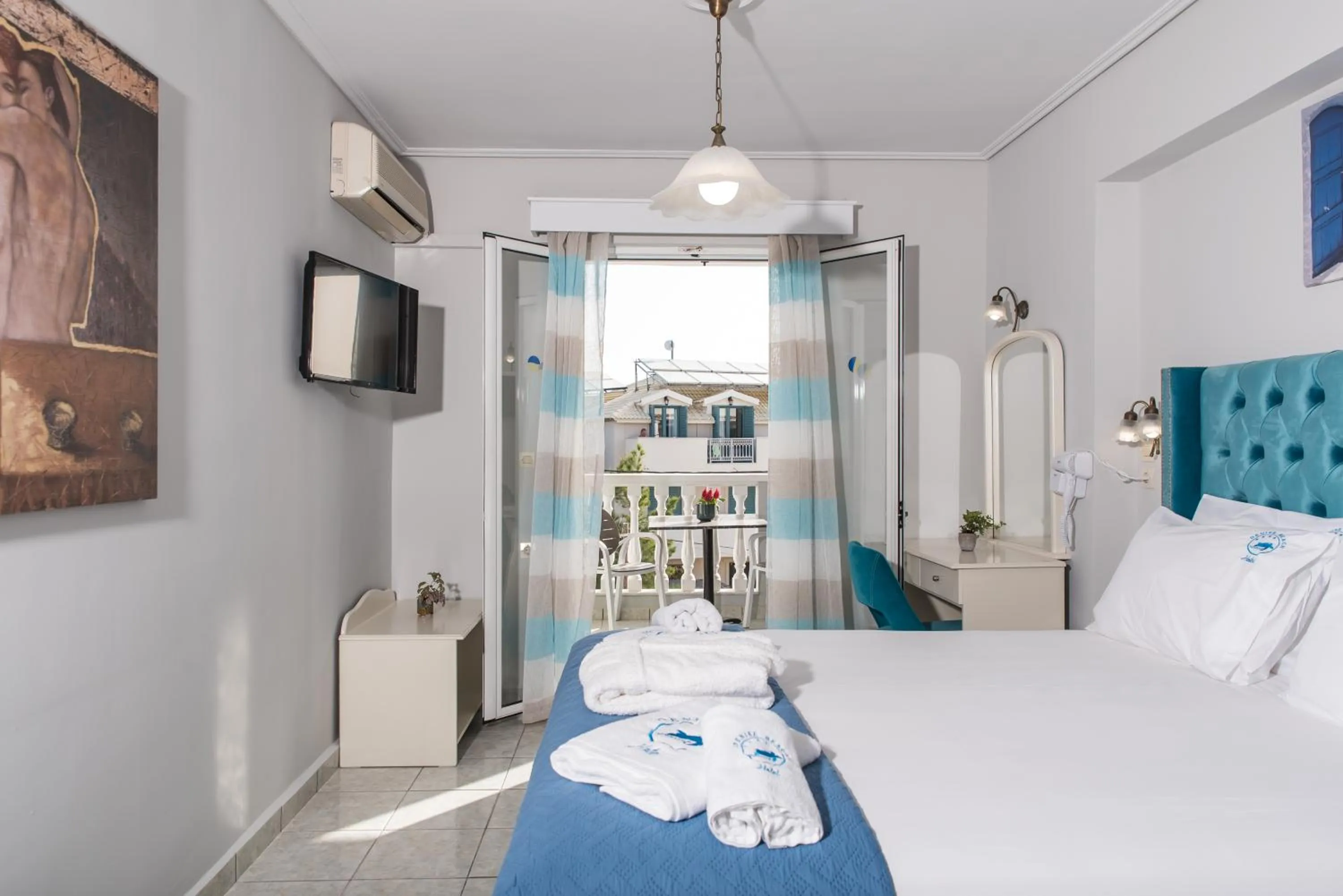 Bed in Denise Beach Hotel