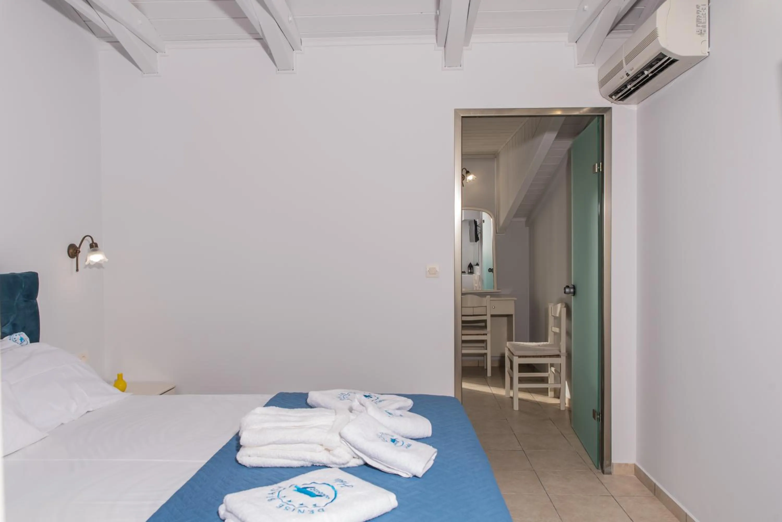 Bed in Denise Beach Hotel