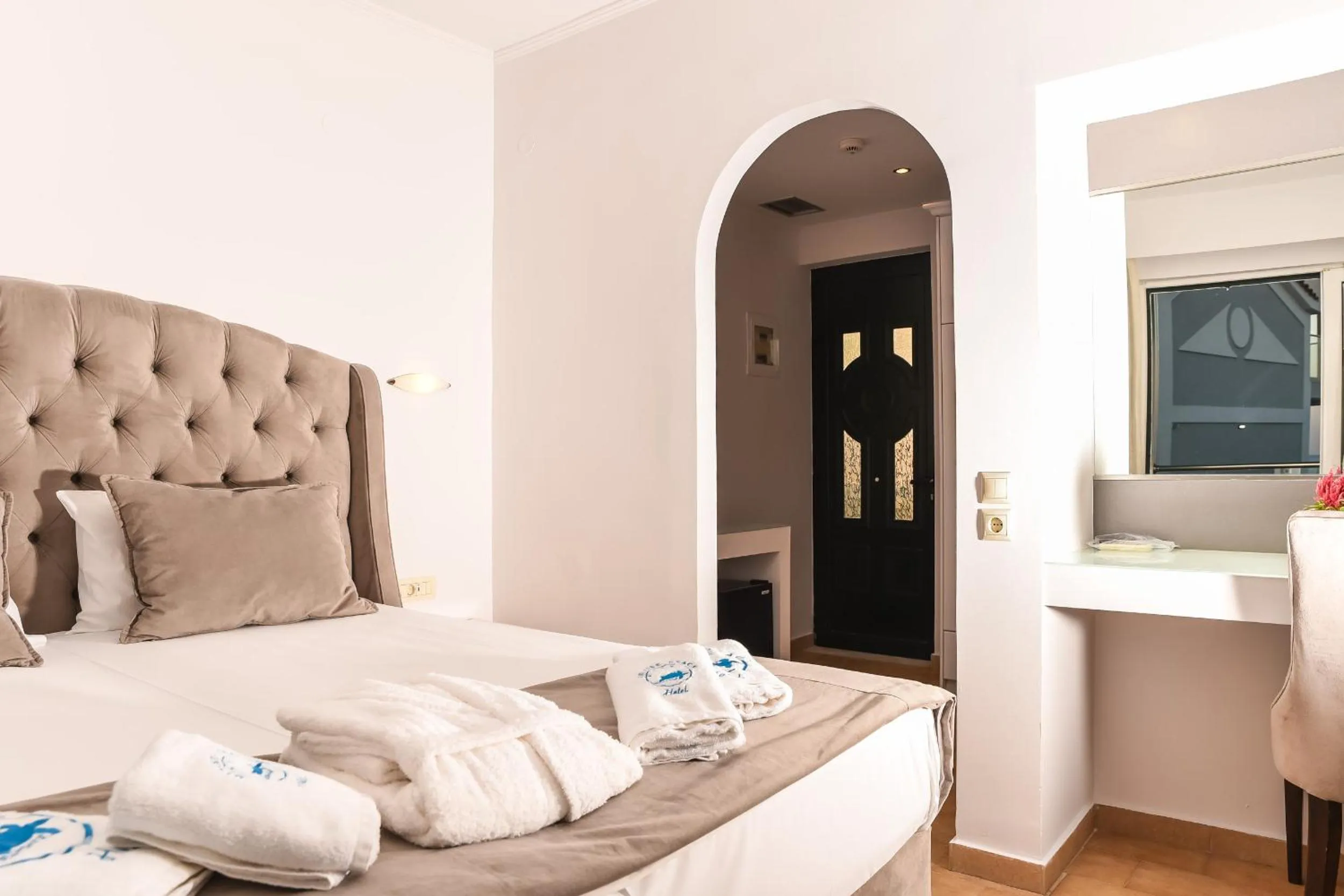 Bed in Denise Beach Hotel