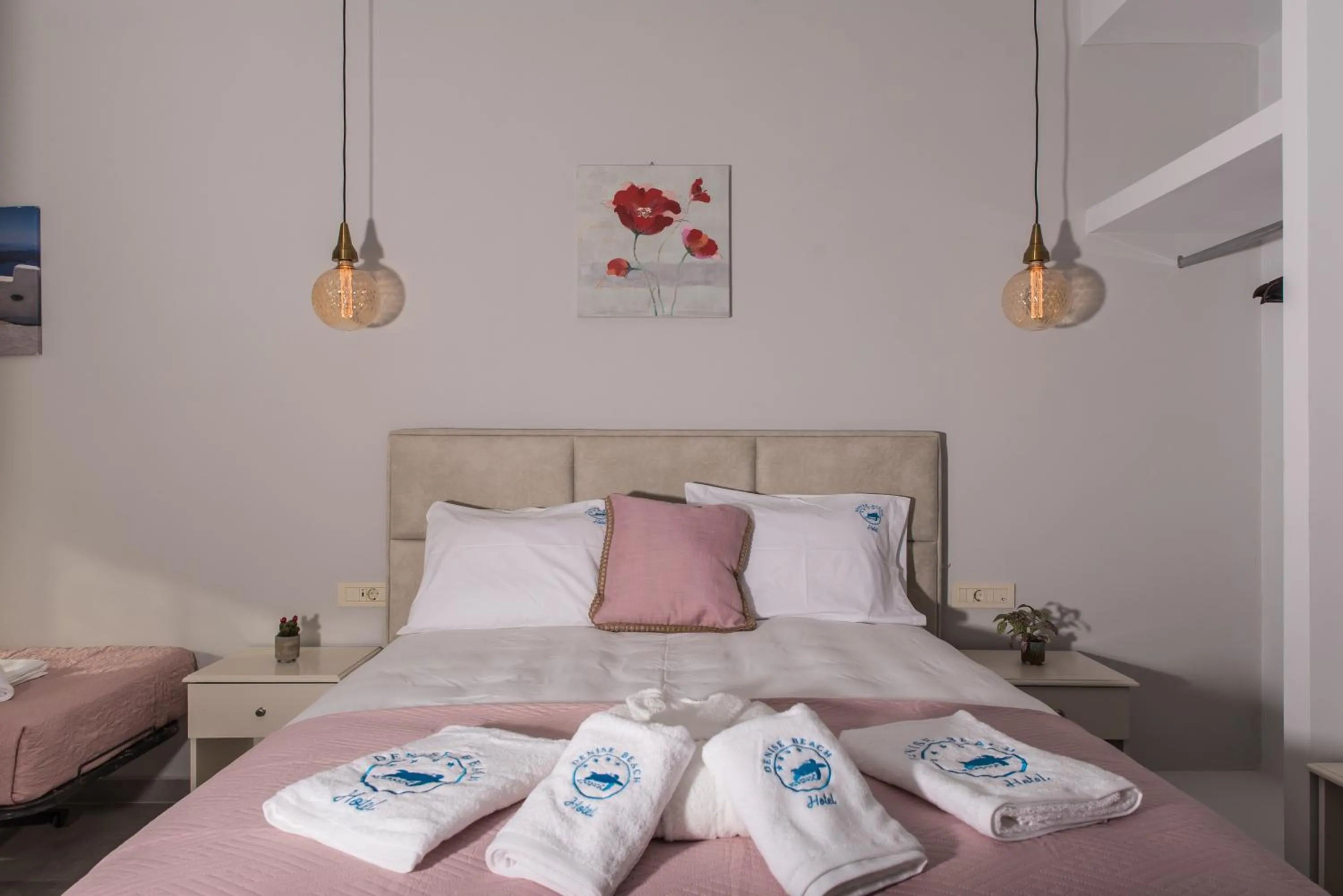 Bed in Denise Beach Hotel