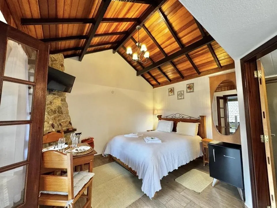 Bed in Pousada Alto de Monte Verde