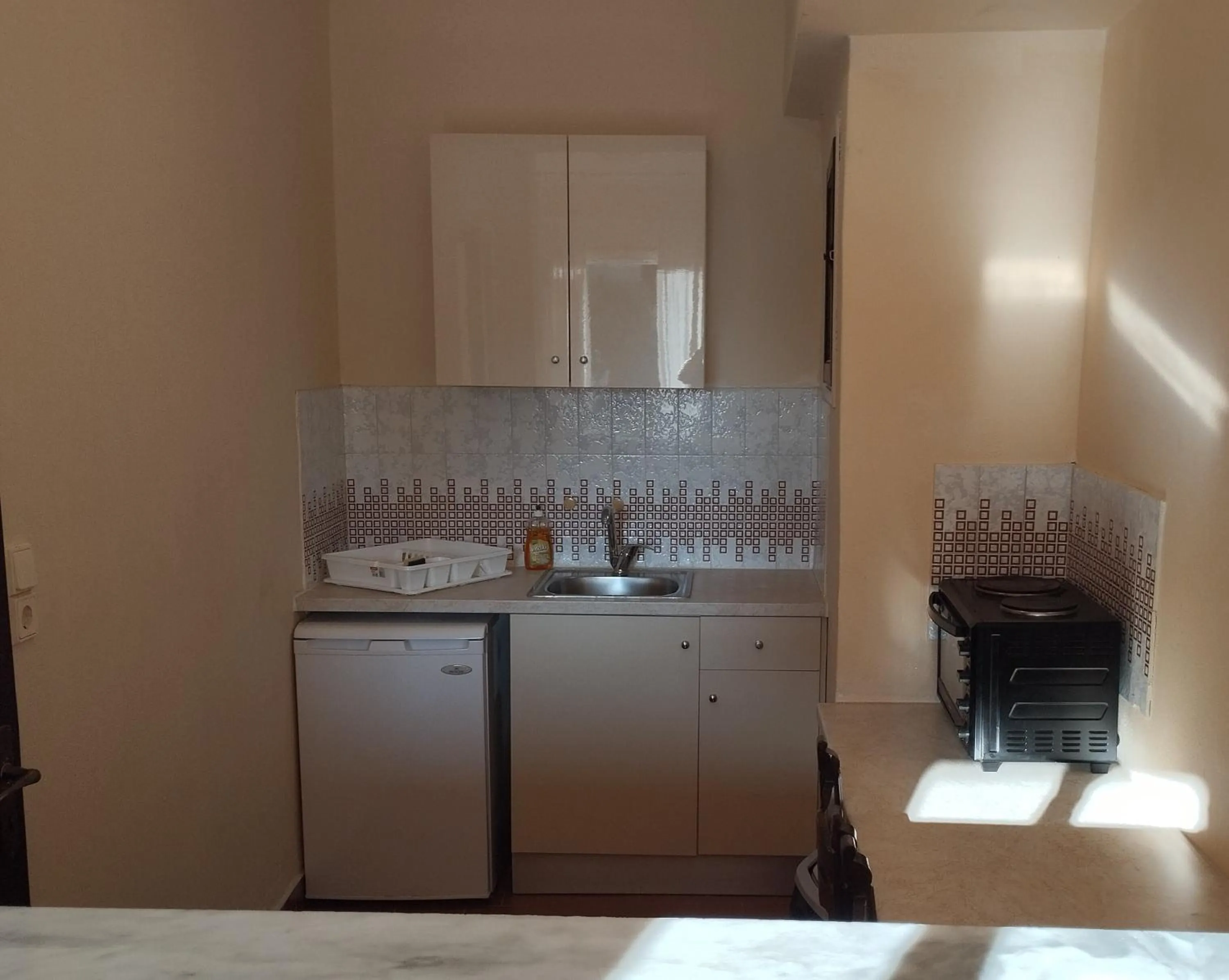 Kitchen or kitchenette in Annaliza Apartments