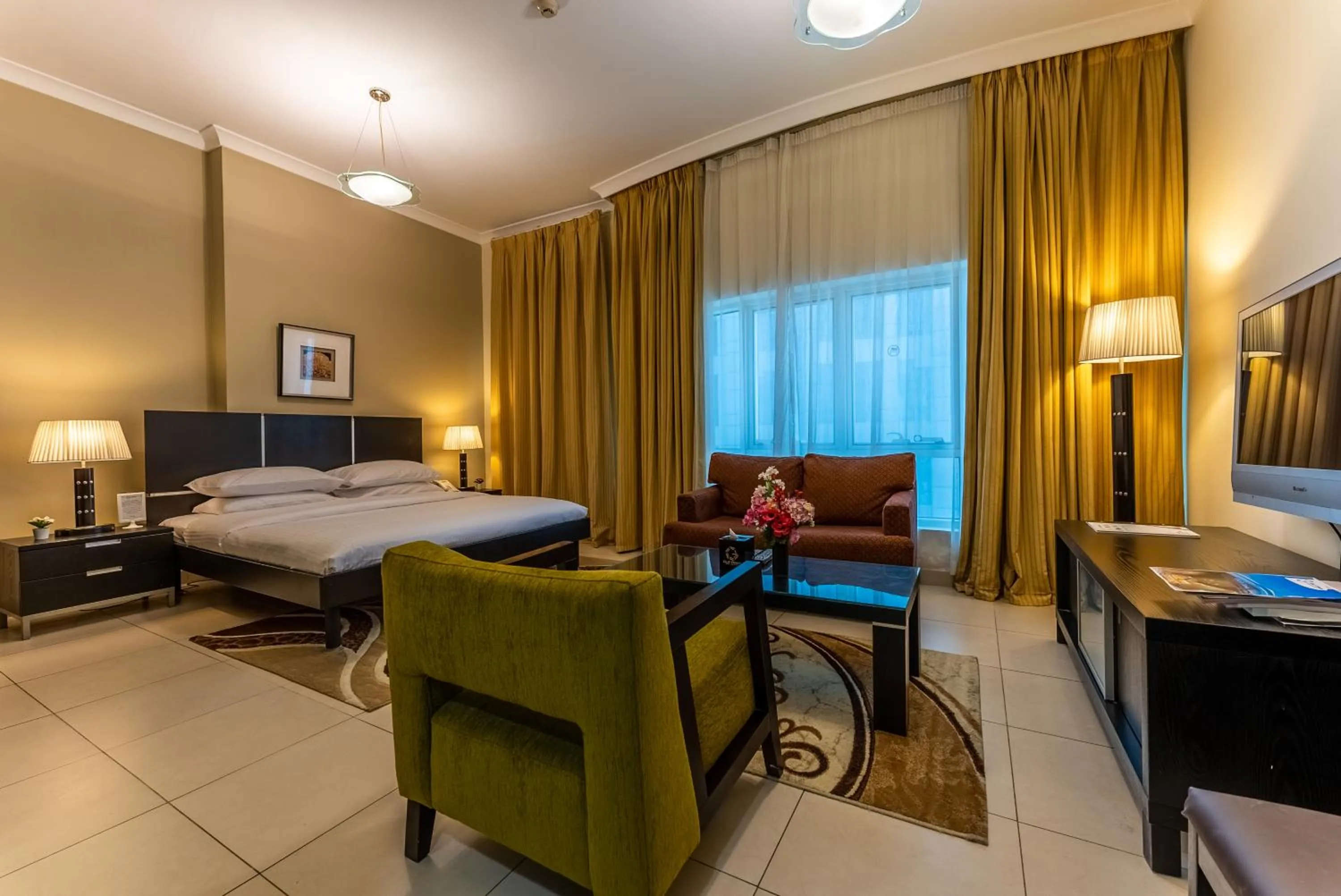 Bed in Gulf Oasis Hotel Apartments Fz LLC