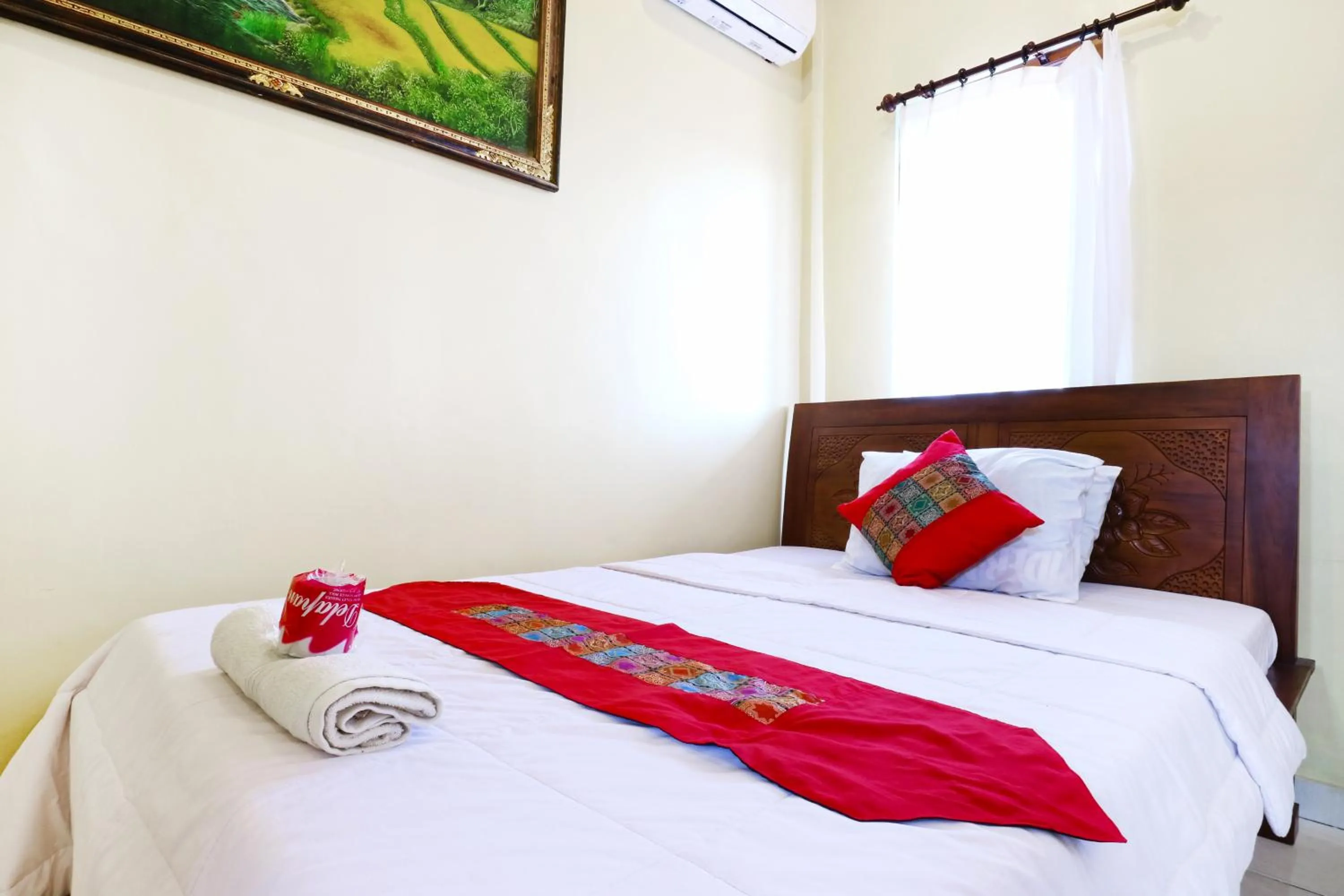 Bed in Jungut Guest House Ubud