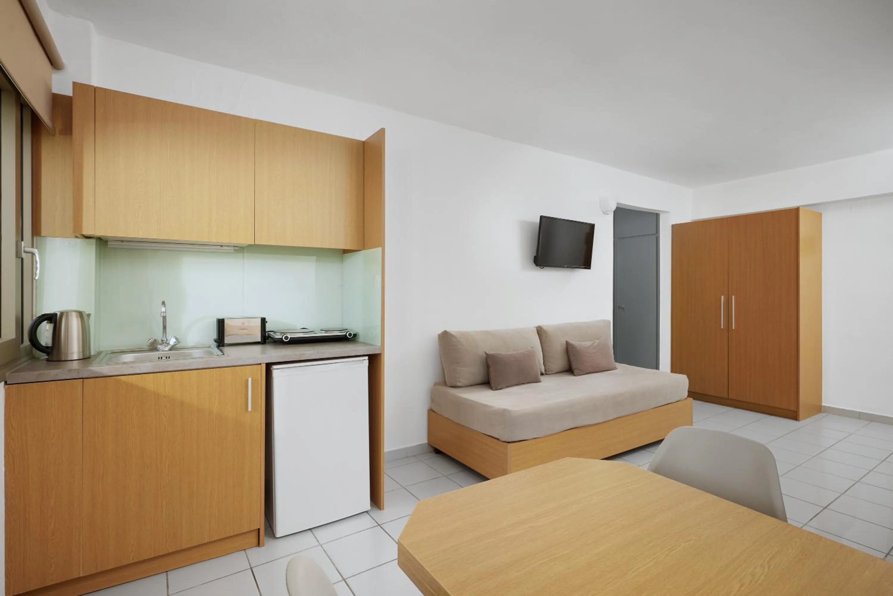 Bed in Acropolis Apartments