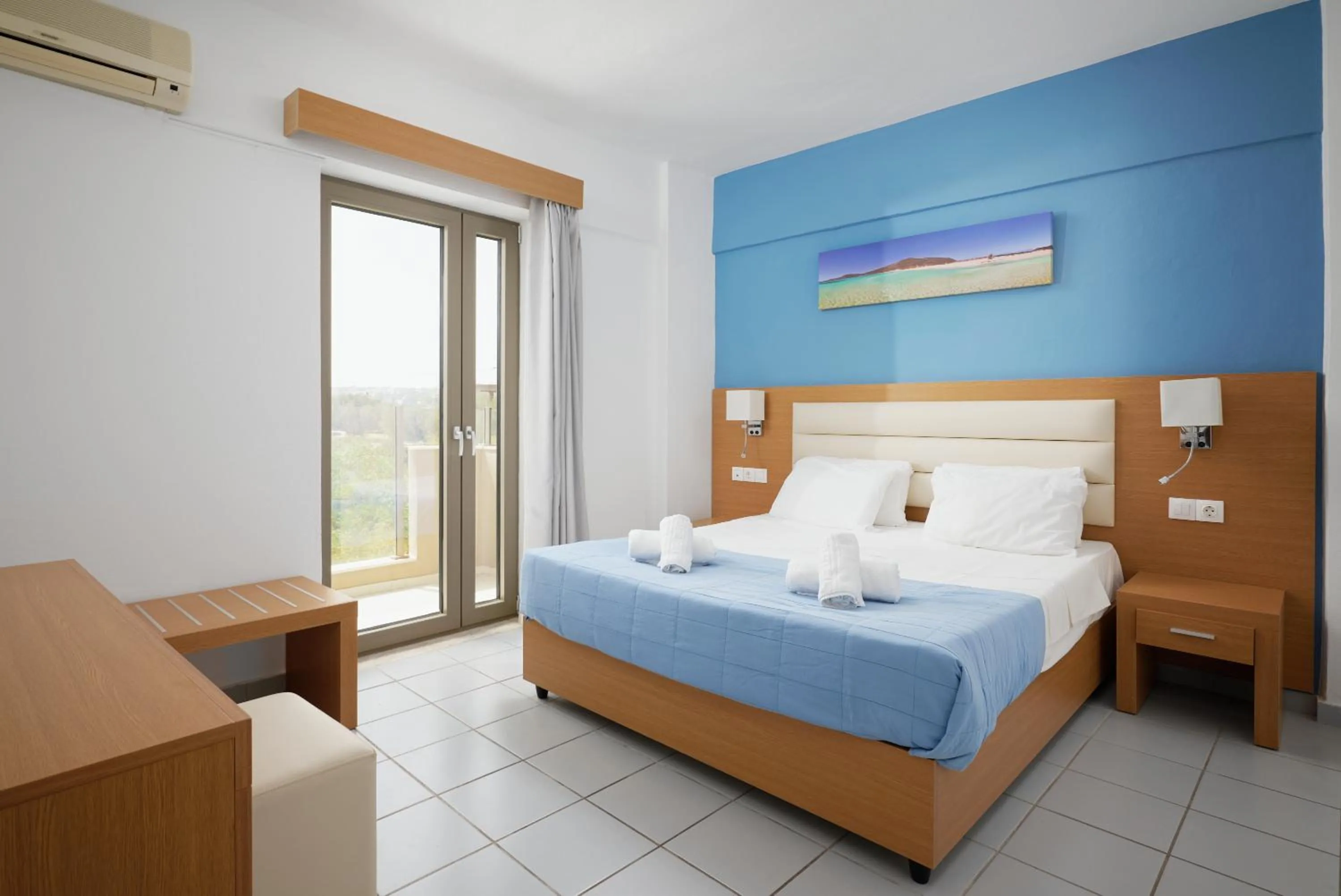 Bed in Acropolis Apartments