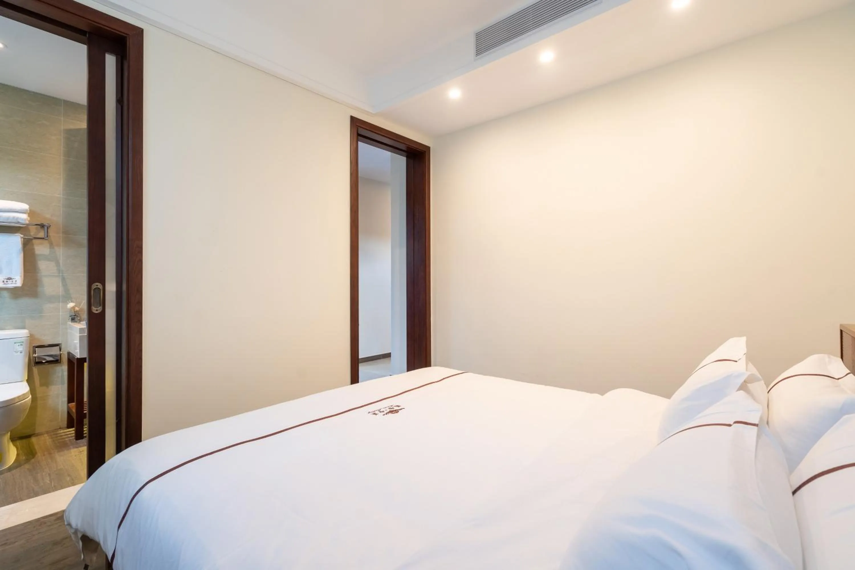 Bed in Iccssi Villa Haitang Bay Sanya