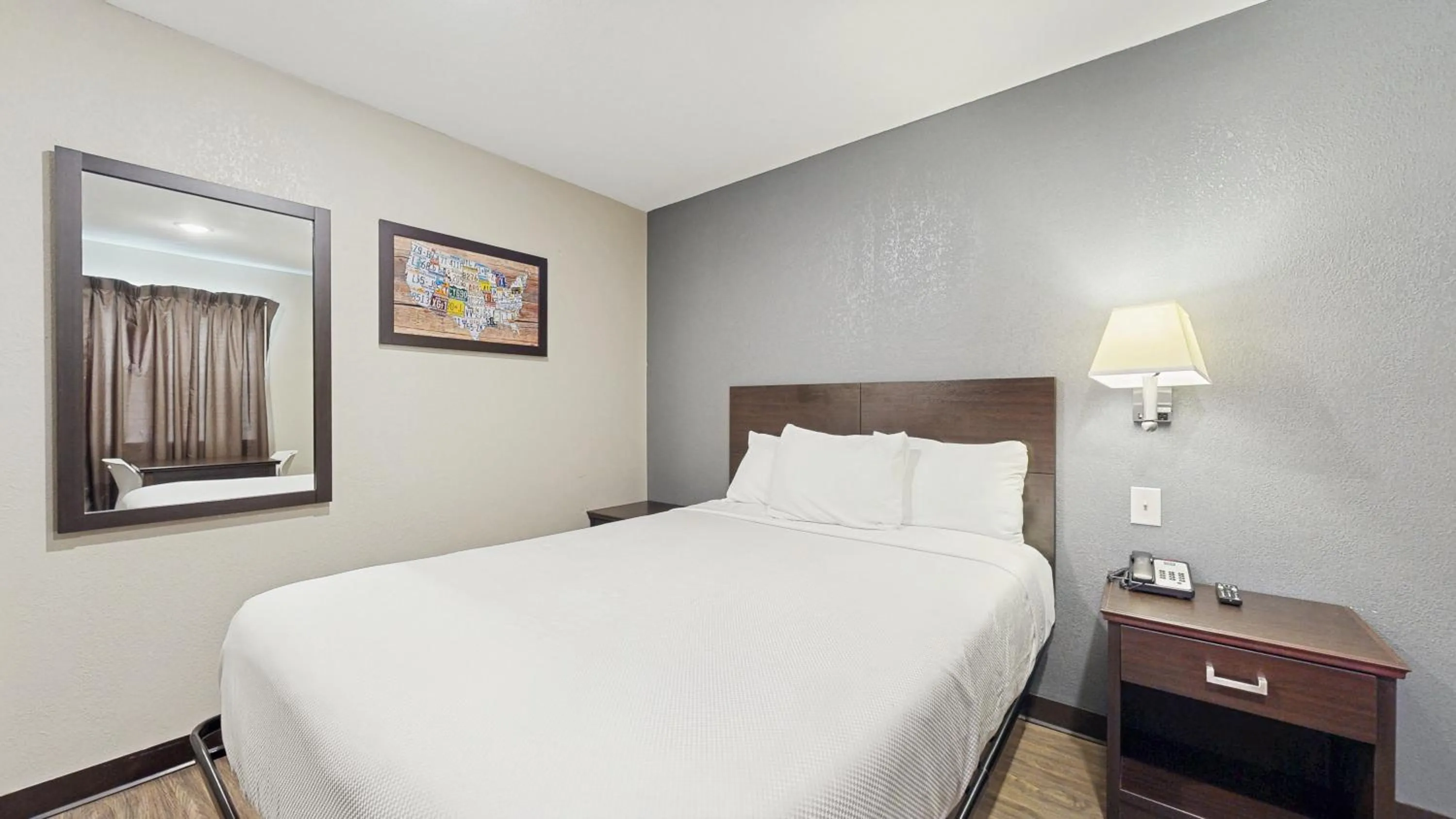 Bed in Red Lion Inn & Suites Olathe Kansas City