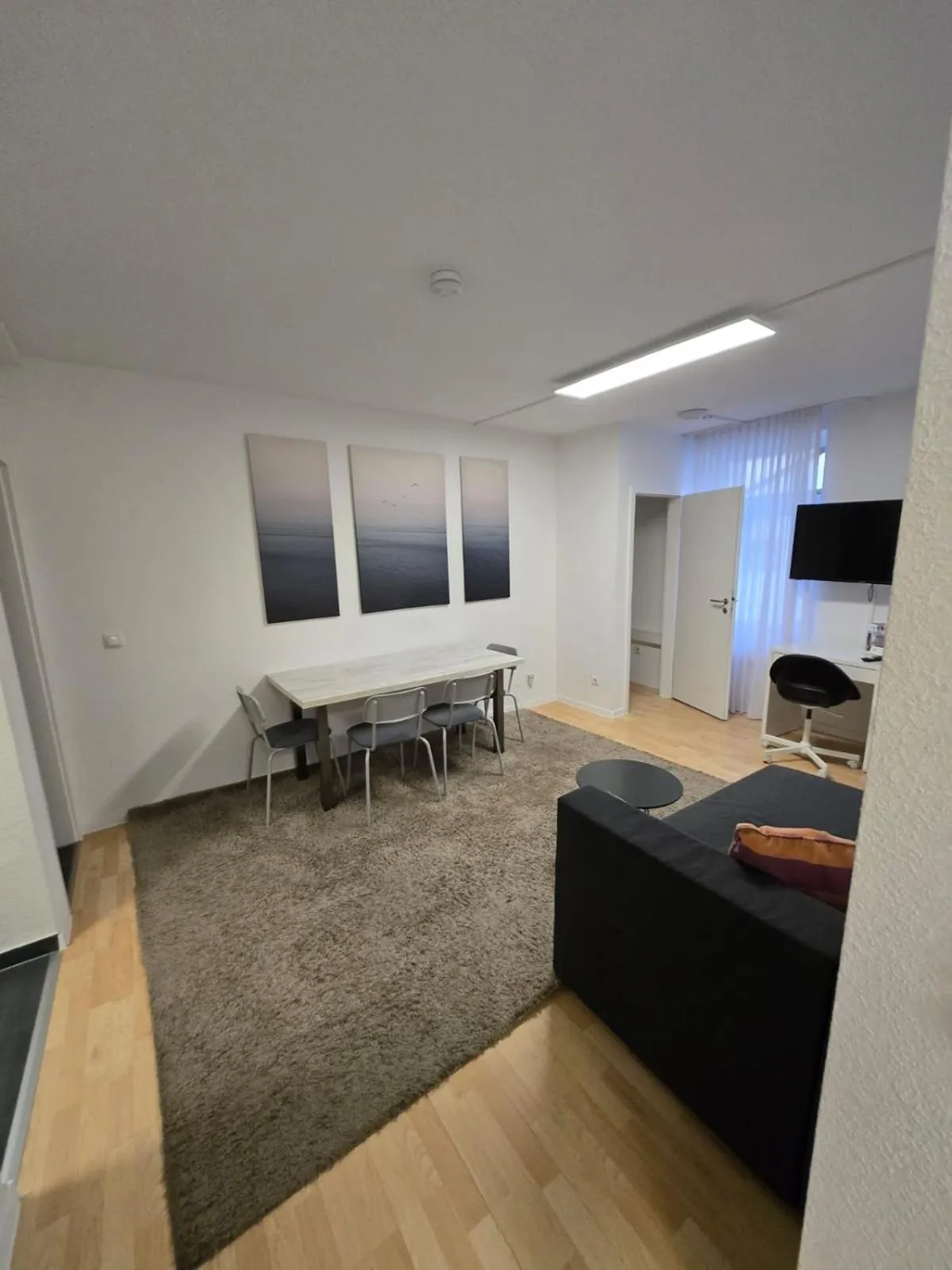 Communal lounge/ TV room, Bed in Hotel Meyer