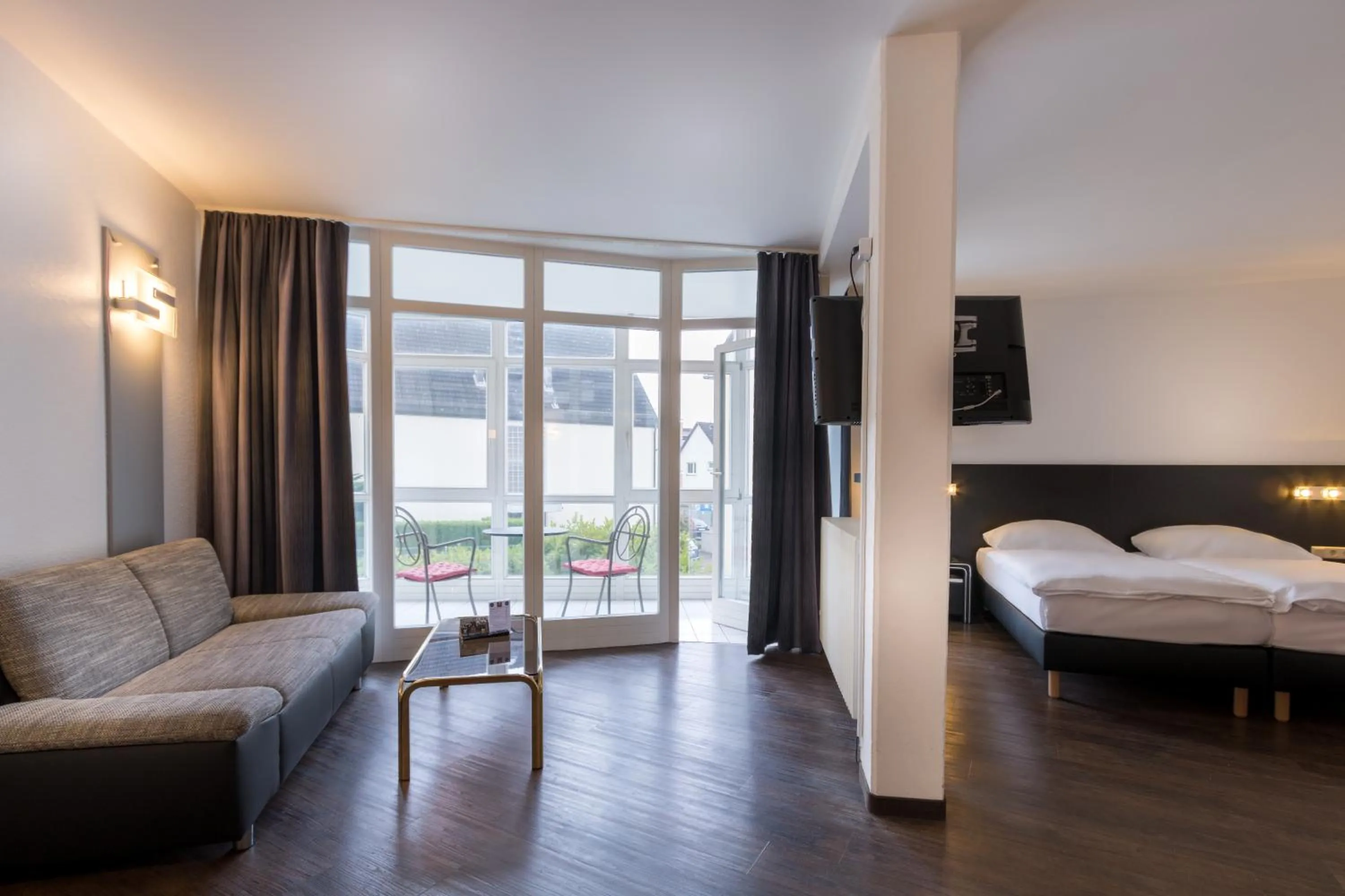 Photo of the whole room, Bed in Turmhotel Rhein-Main