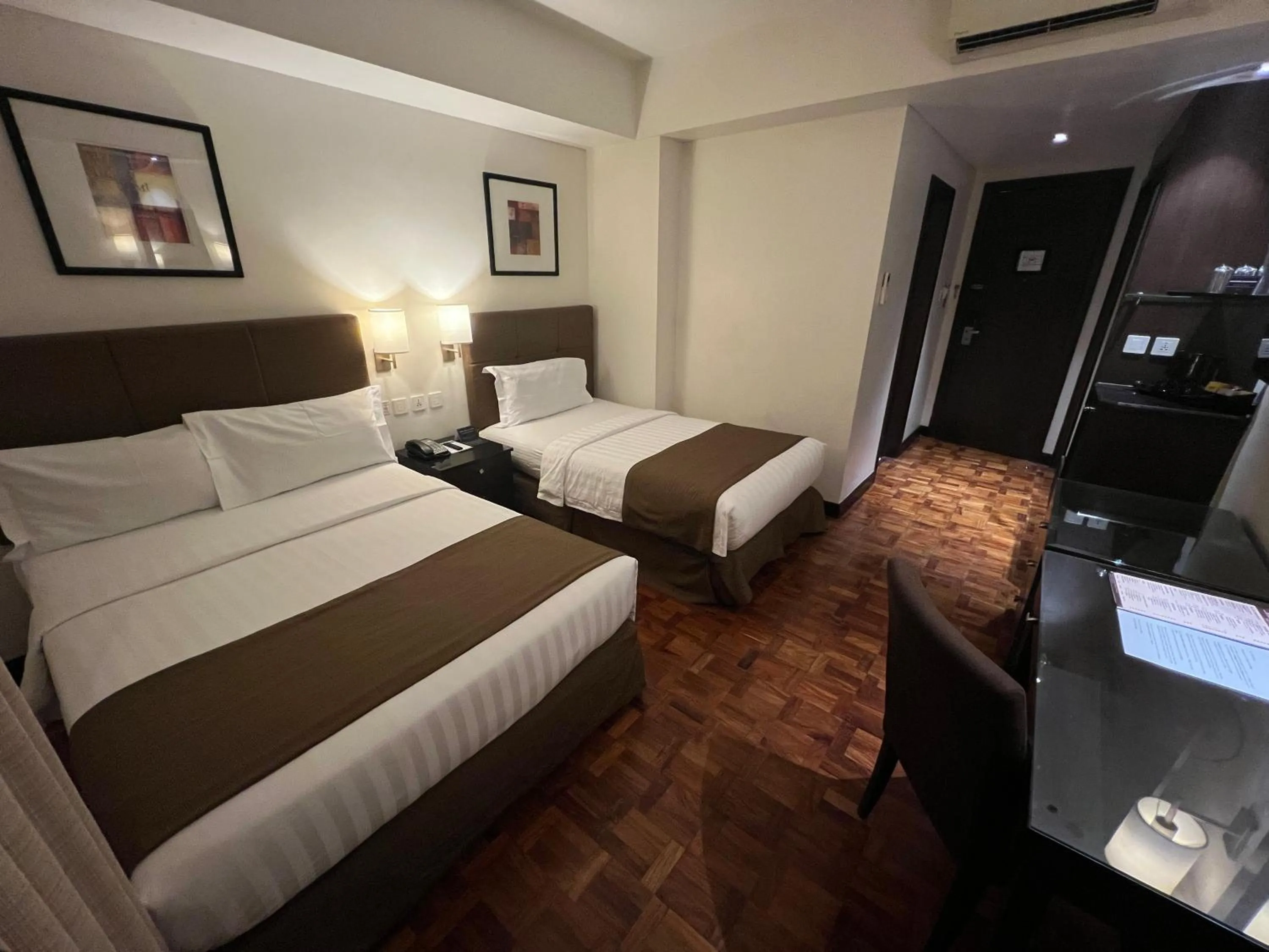 Bed in City Garden Hotel Makati