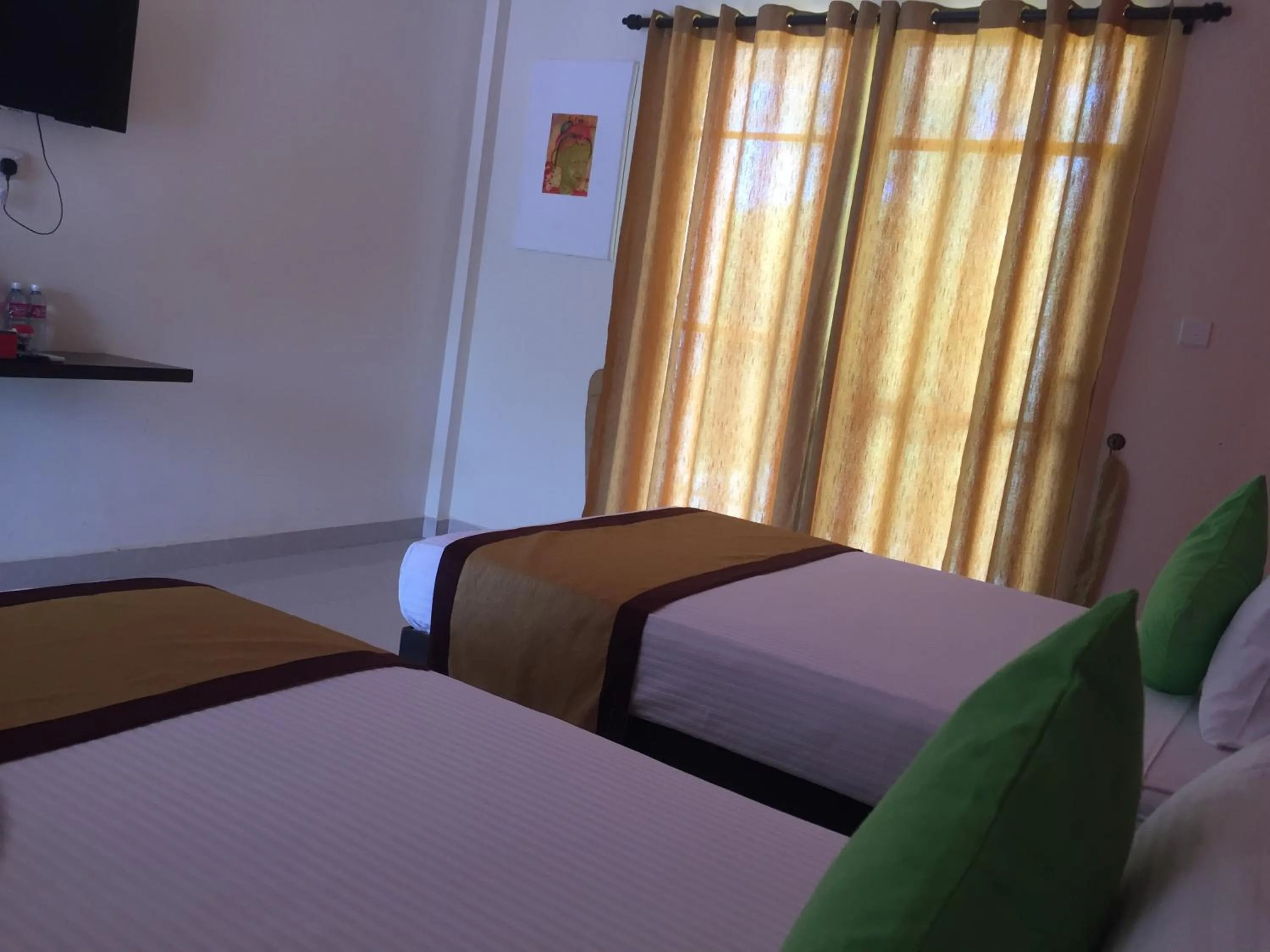 Bed in Organic Garden Resort Sigiriya