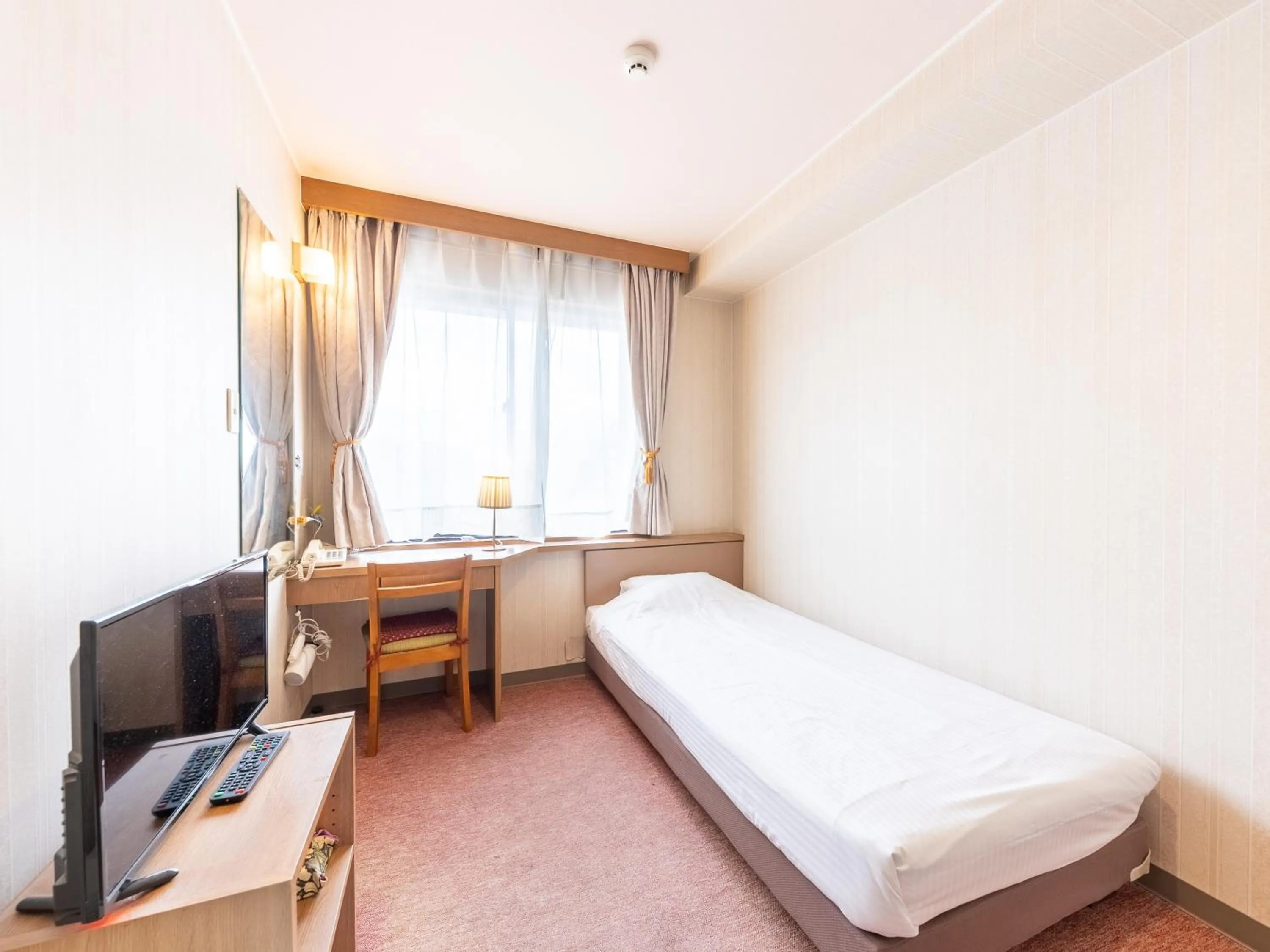 Bed in Tabist Business Hotel R Side Kanazawa