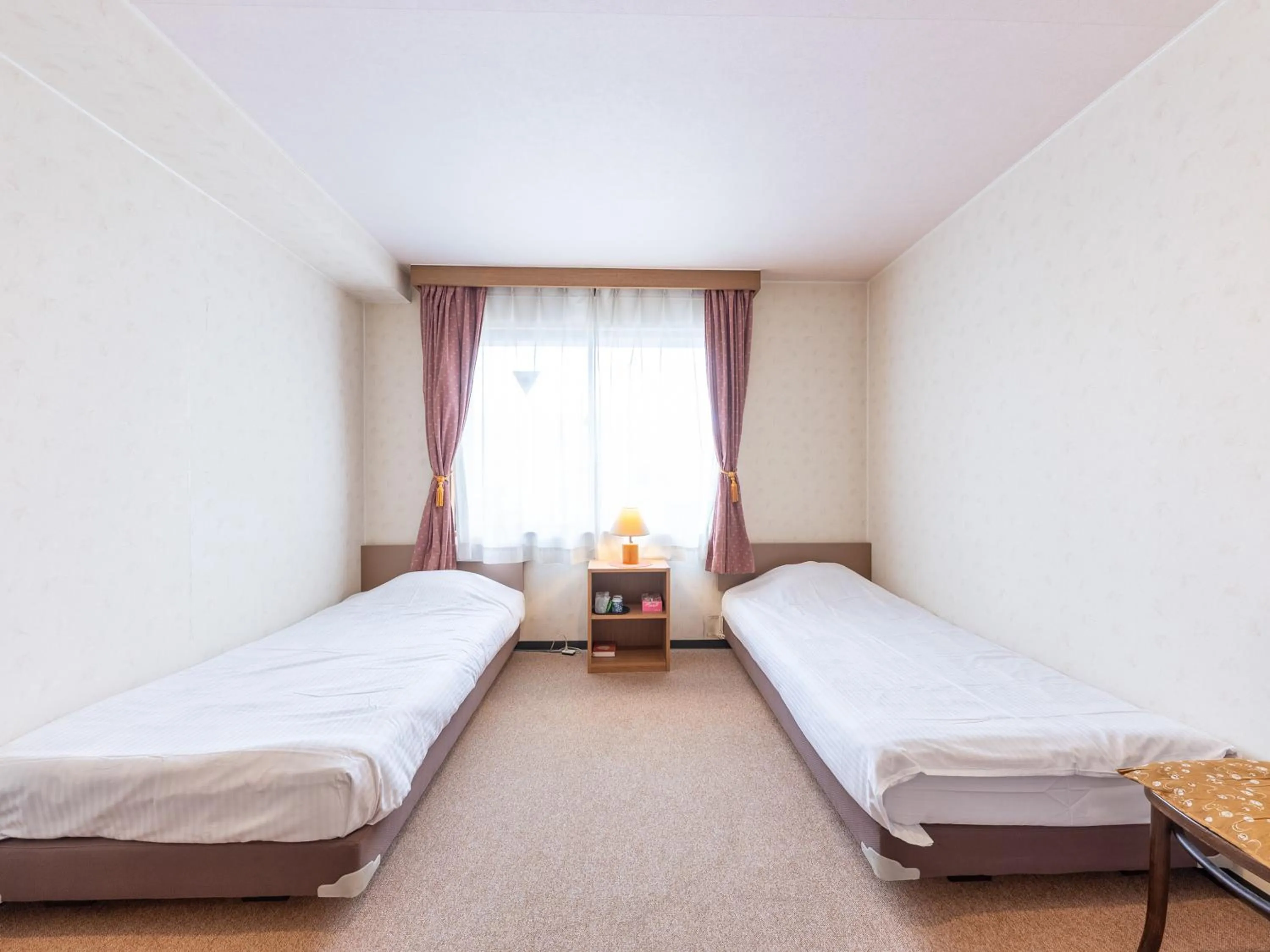 Bed in Tabist Business Hotel R Side Kanazawa