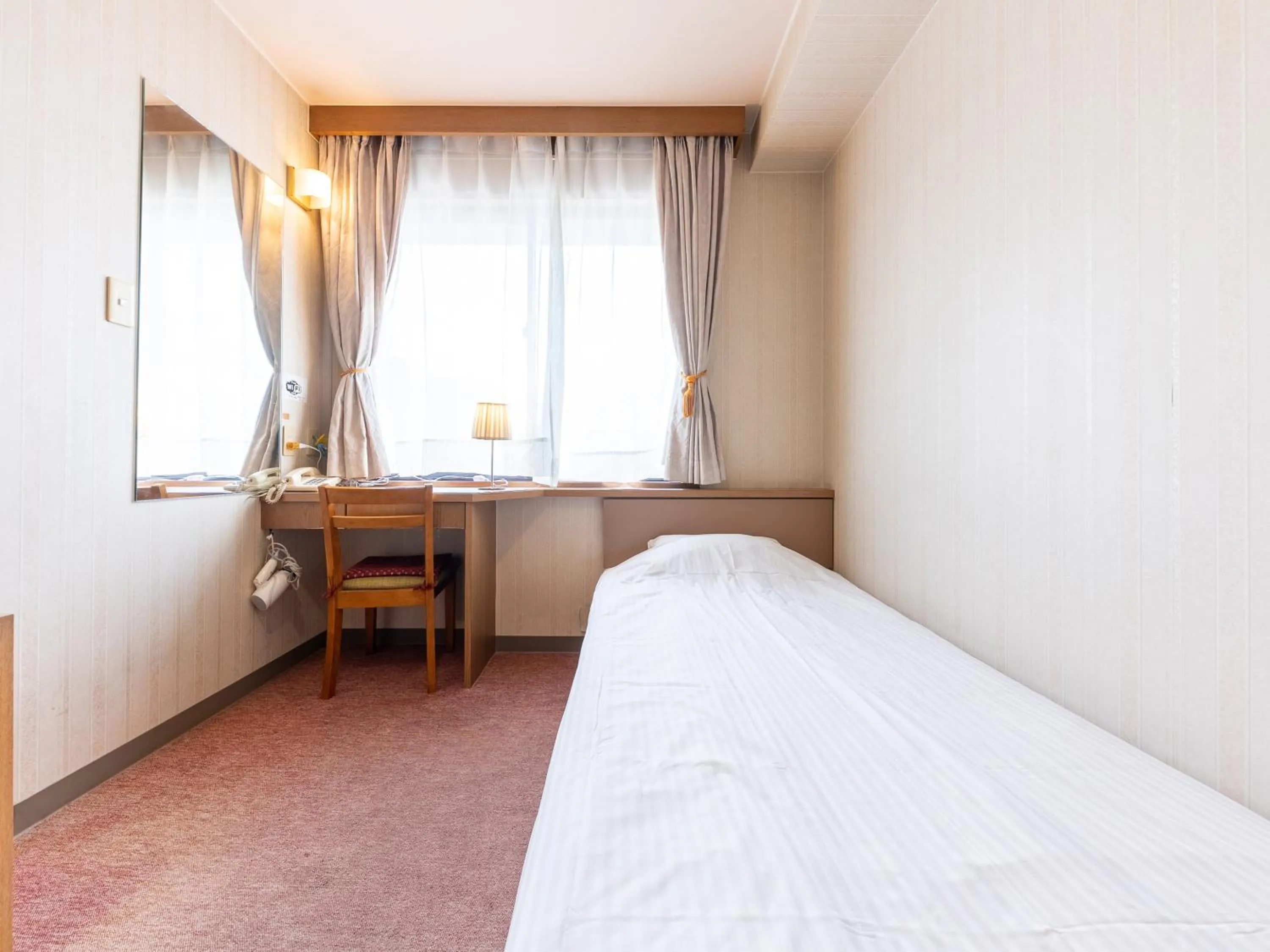 Bed in Tabist Business Hotel R Side Kanazawa