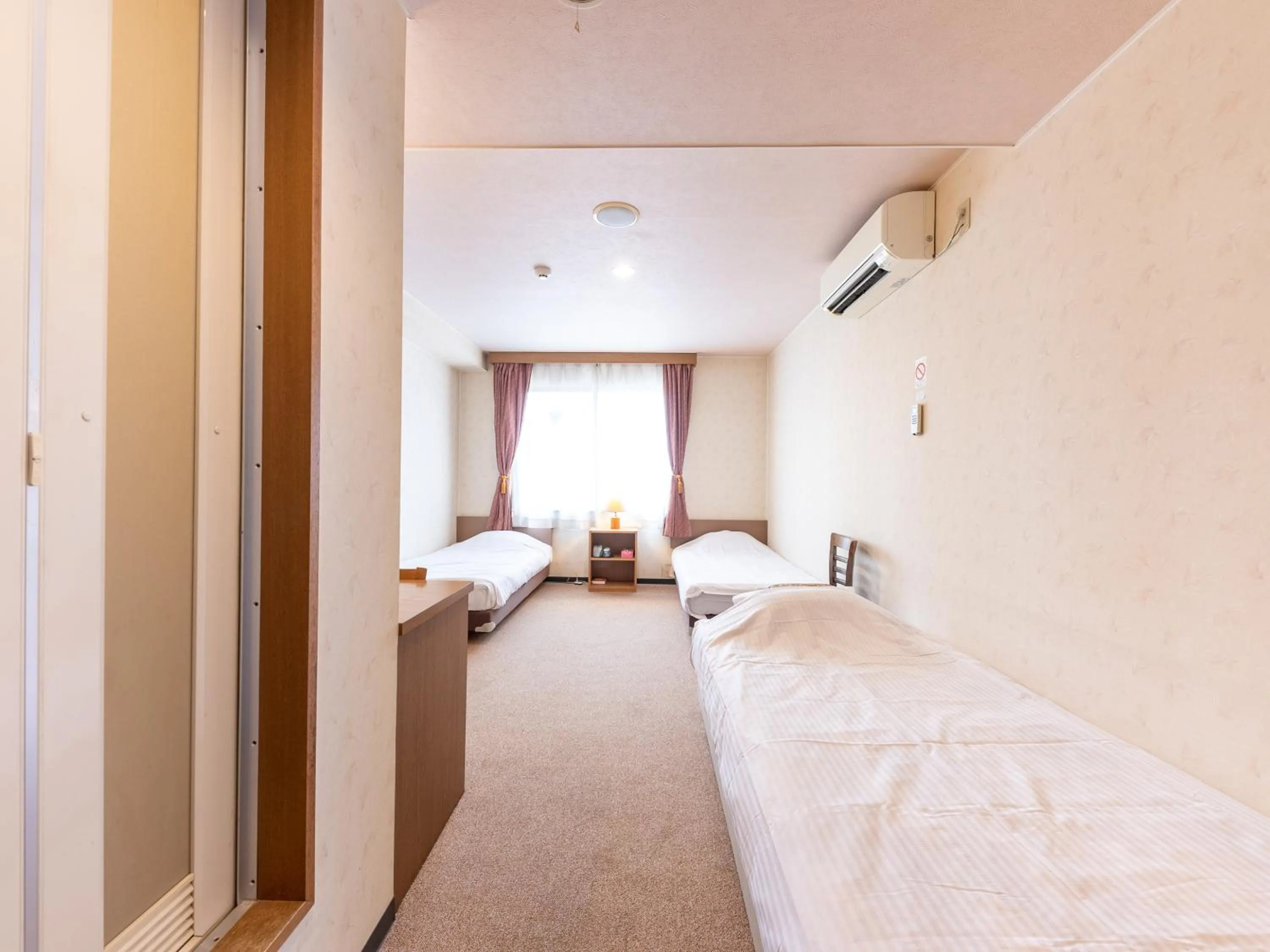 Bed in Tabist Business Hotel R Side Kanazawa