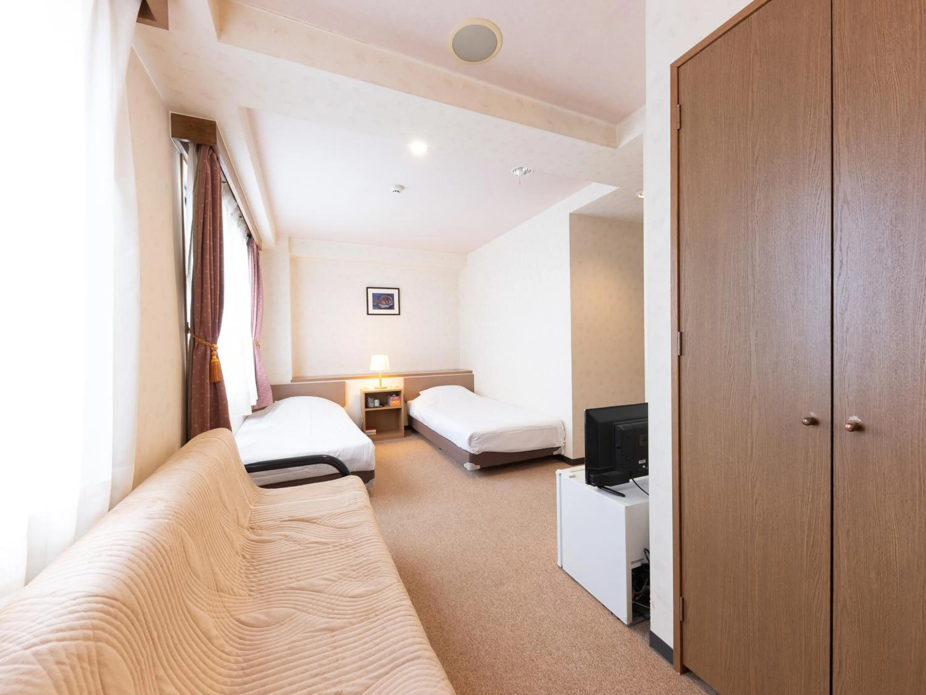 Bed in Tabist Business Hotel R Side Kanazawa