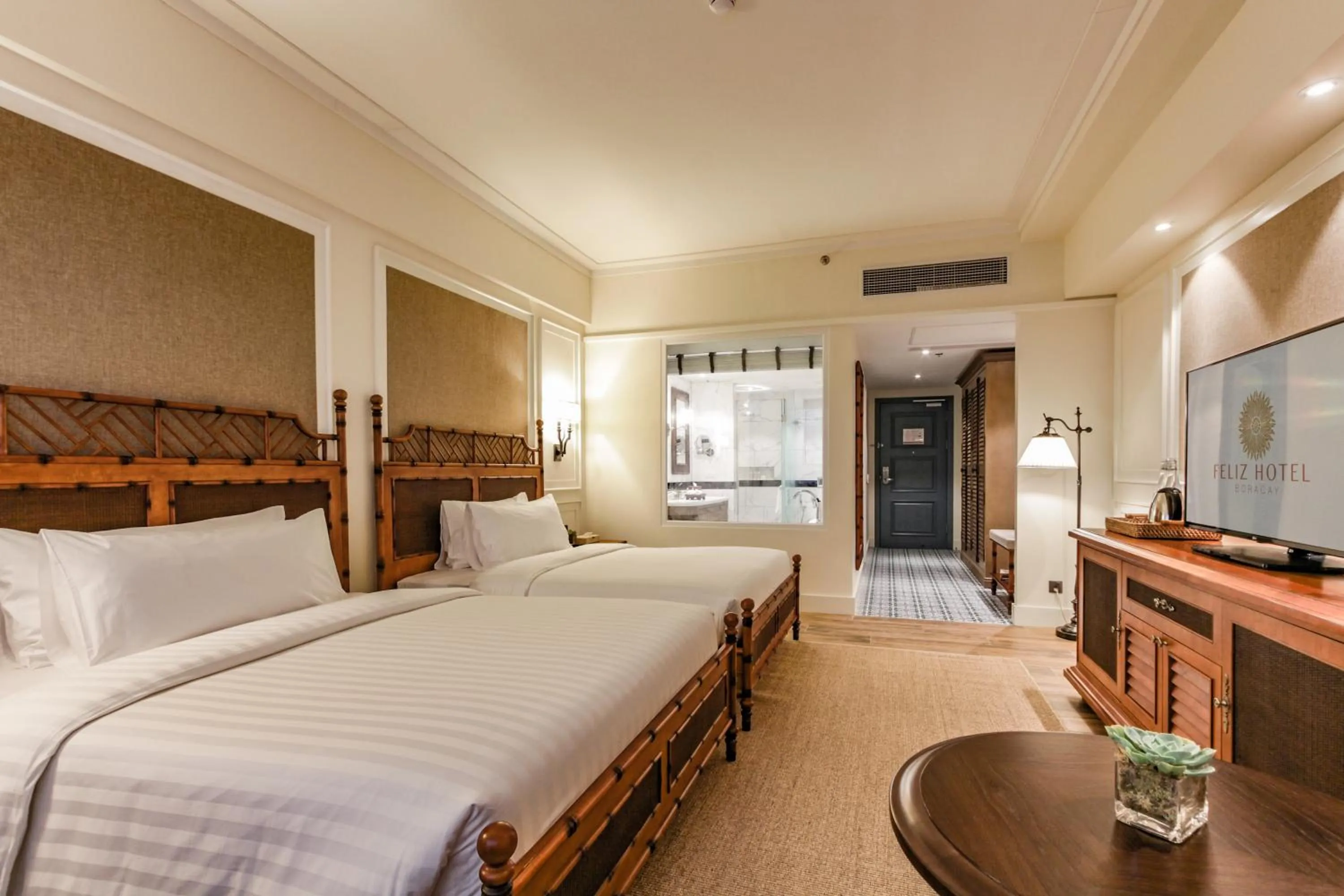 Photo of the whole room, Bed in Feliz Hotel Boracay