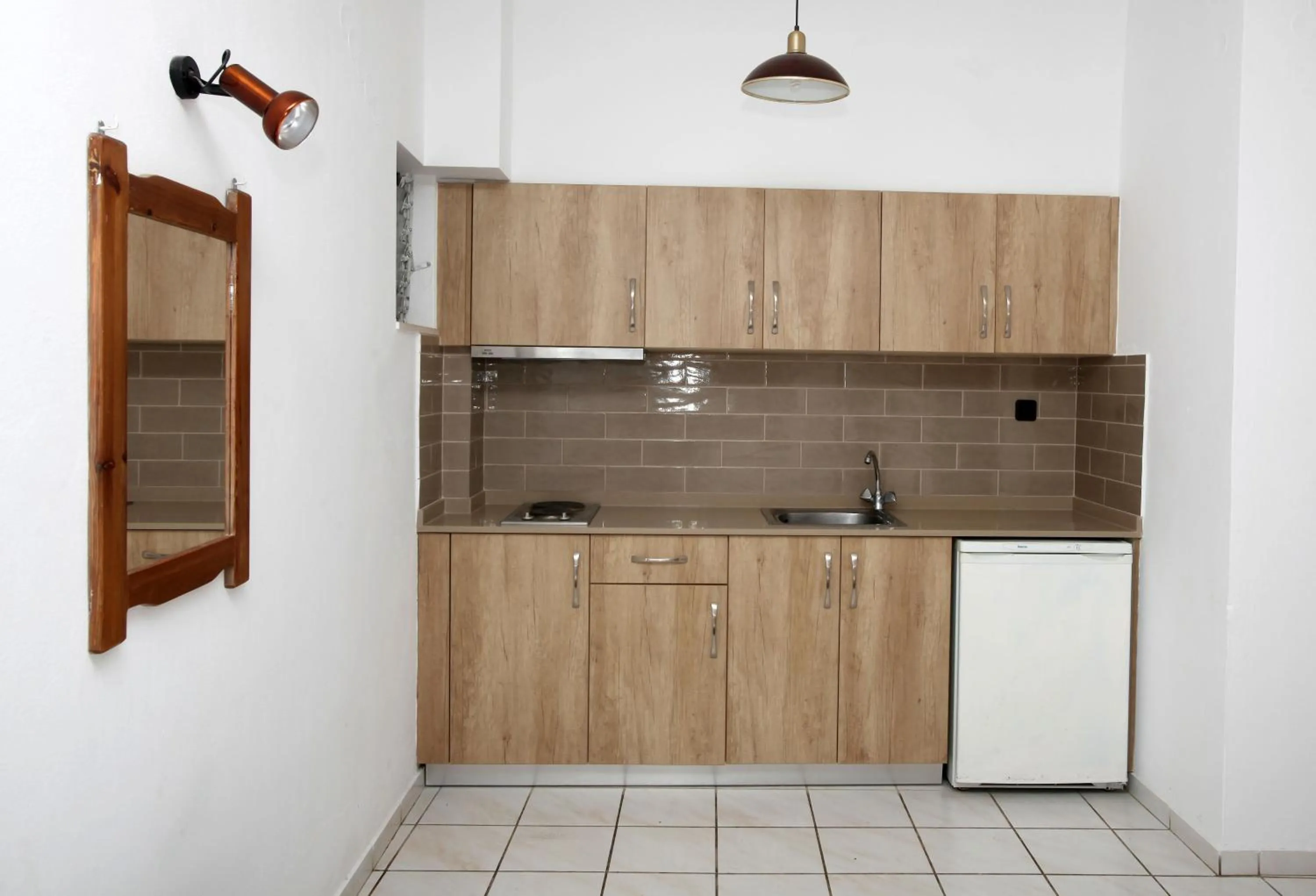 Kitchen or kitchenette in Iraklis Apartments