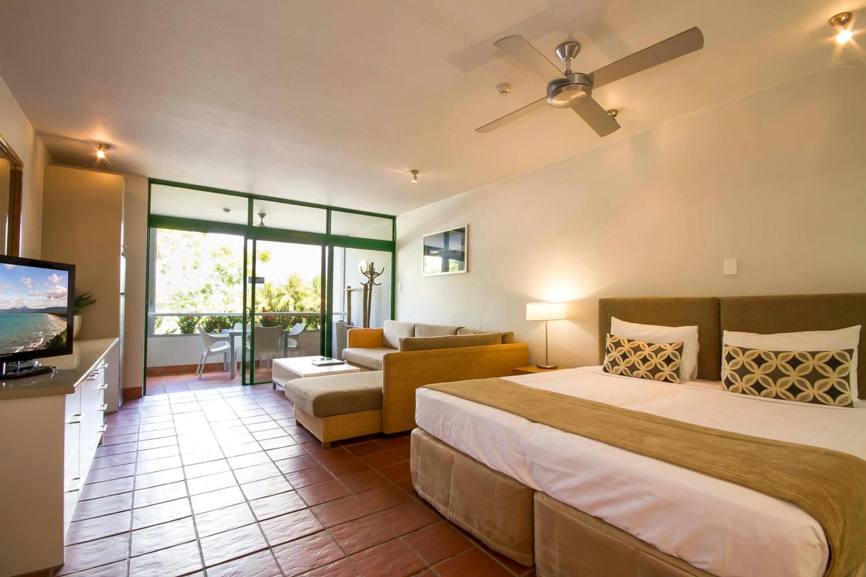 Communal lounge/ TV room, Bed in Club Tropical Resort - Official Onsite Reception & Check In