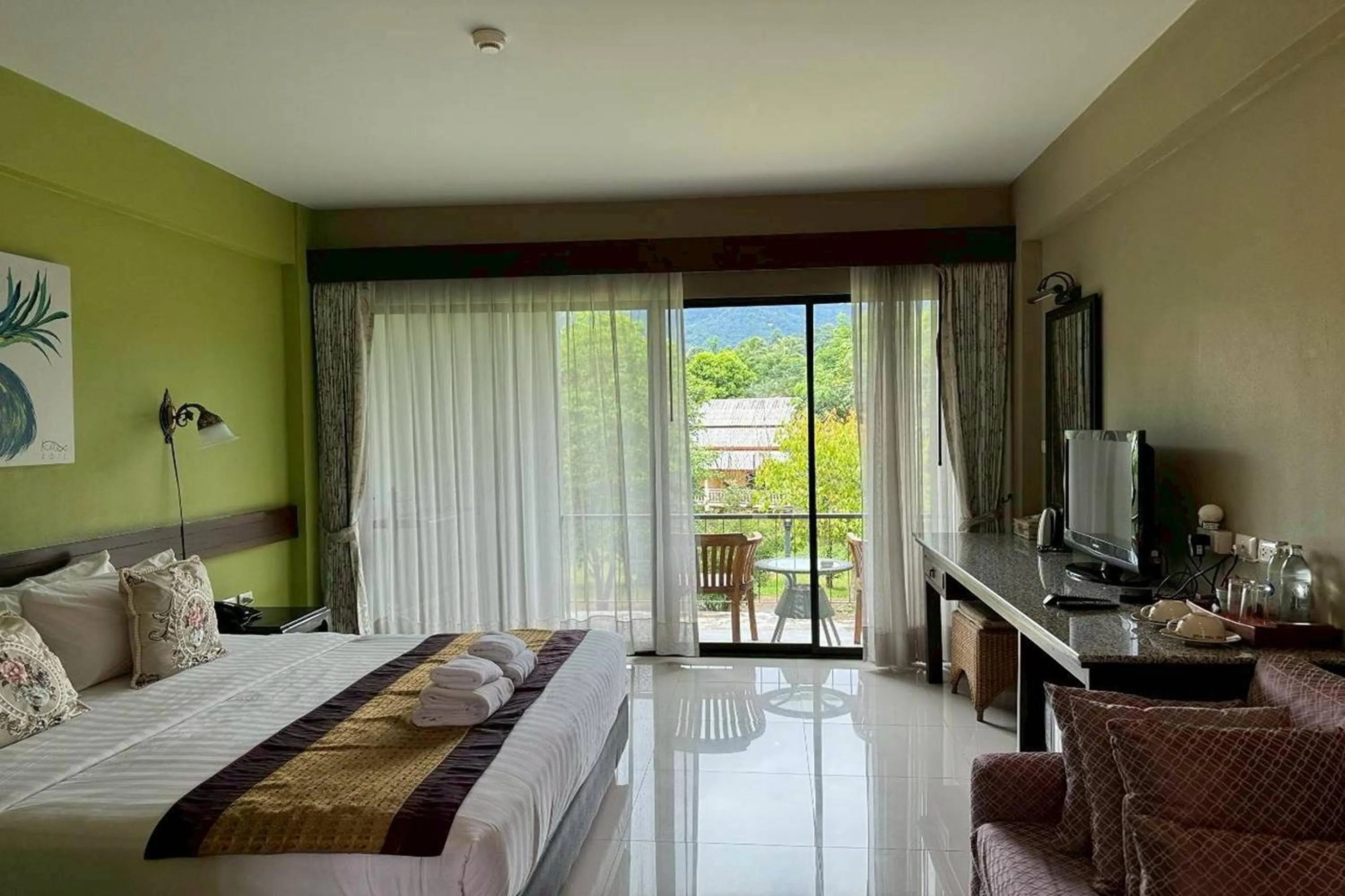 Photo of the whole room, Bed in Poonyamantra Resort Chiang Rai