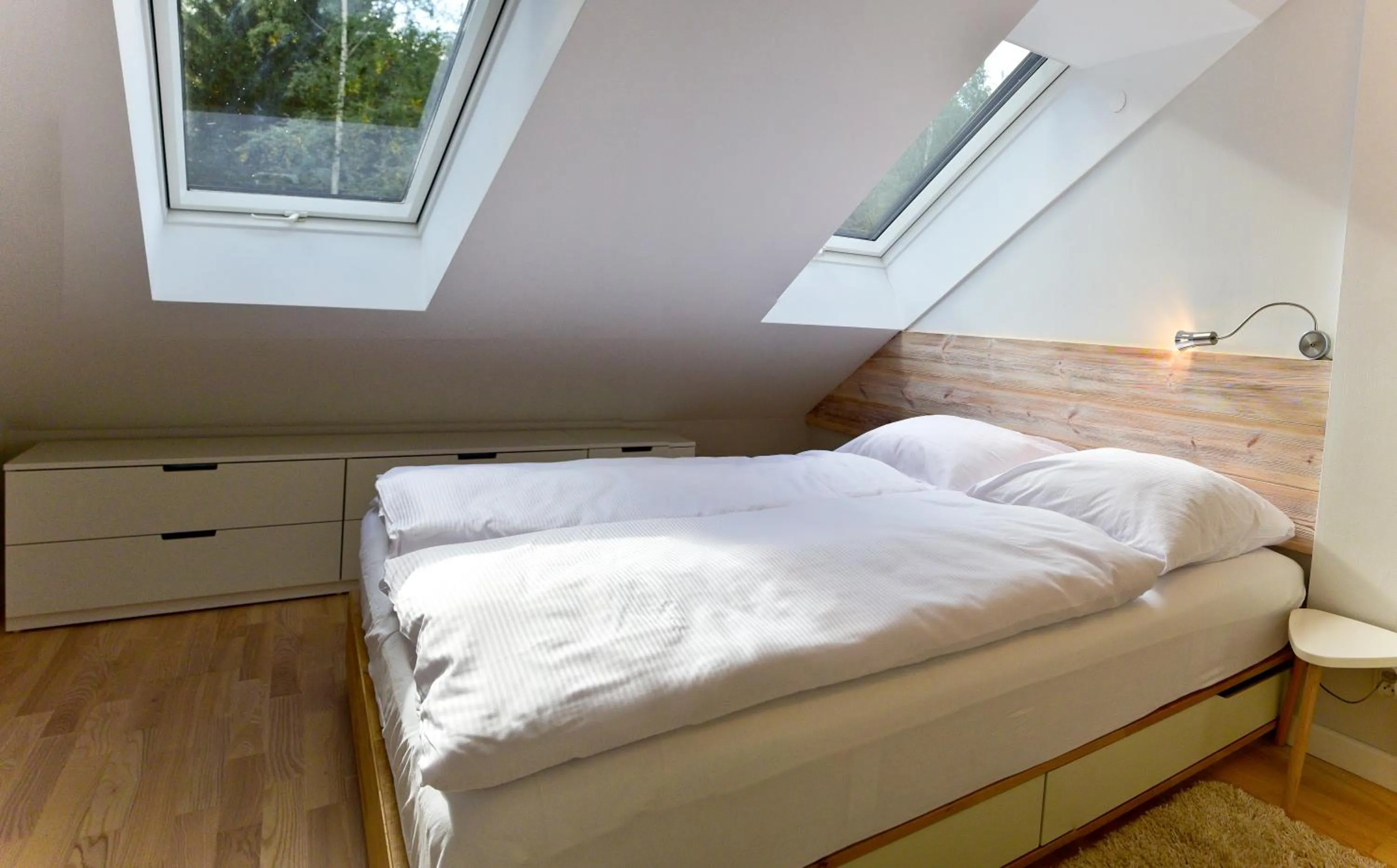 Bed in Apartament Dwupoziomowy z Sauną - Apartamentuj