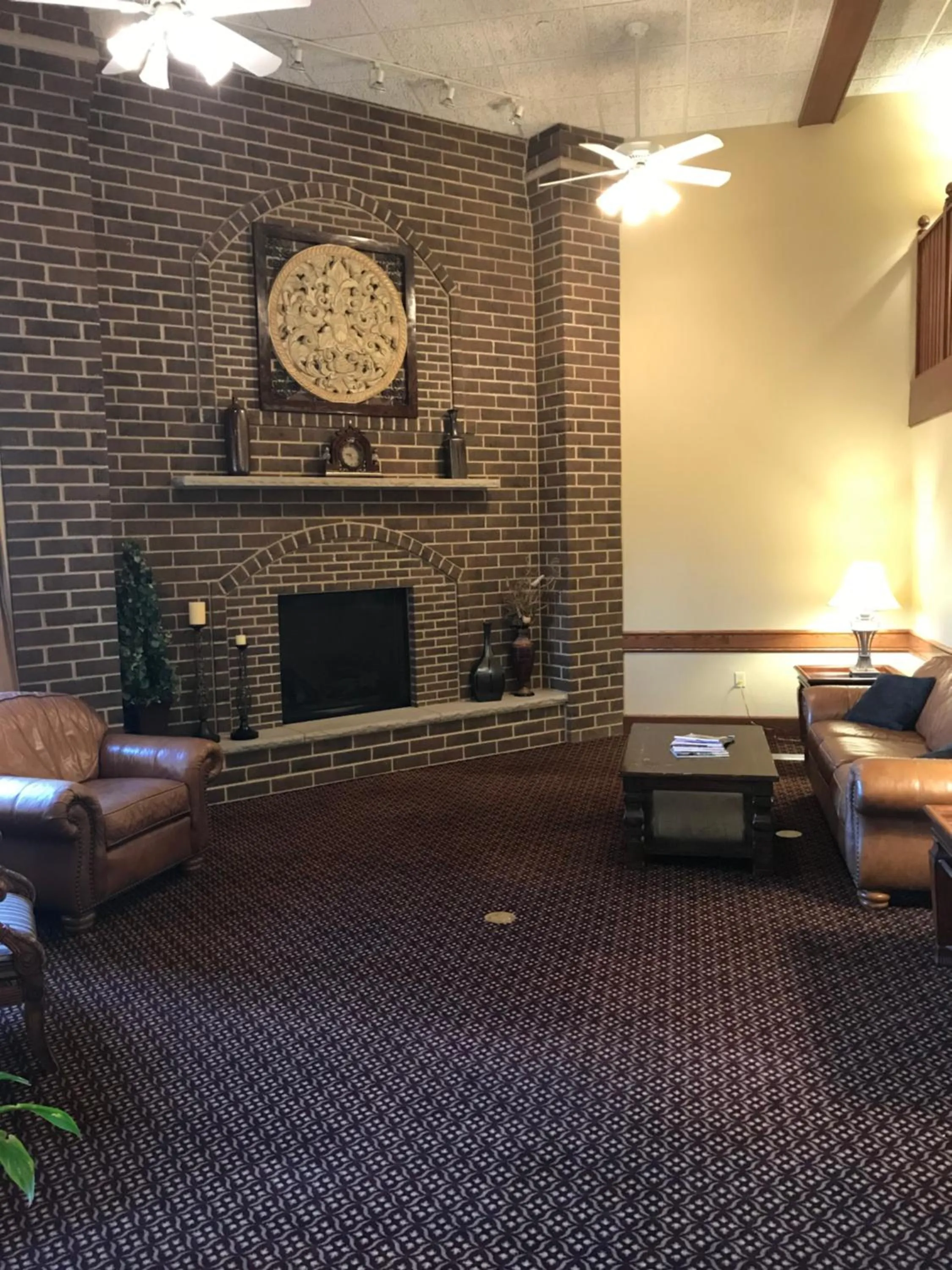 Communal lounge/ TV room in AmericInn by Wyndham Appleton North Little Chute