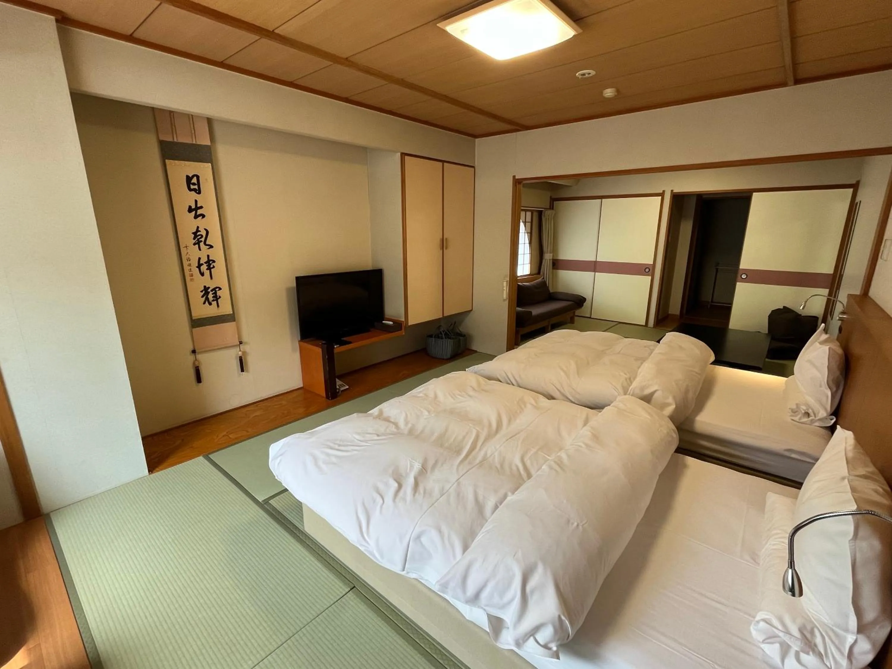 Living room, Bed in Takinoya Bekkan Tamanoyu