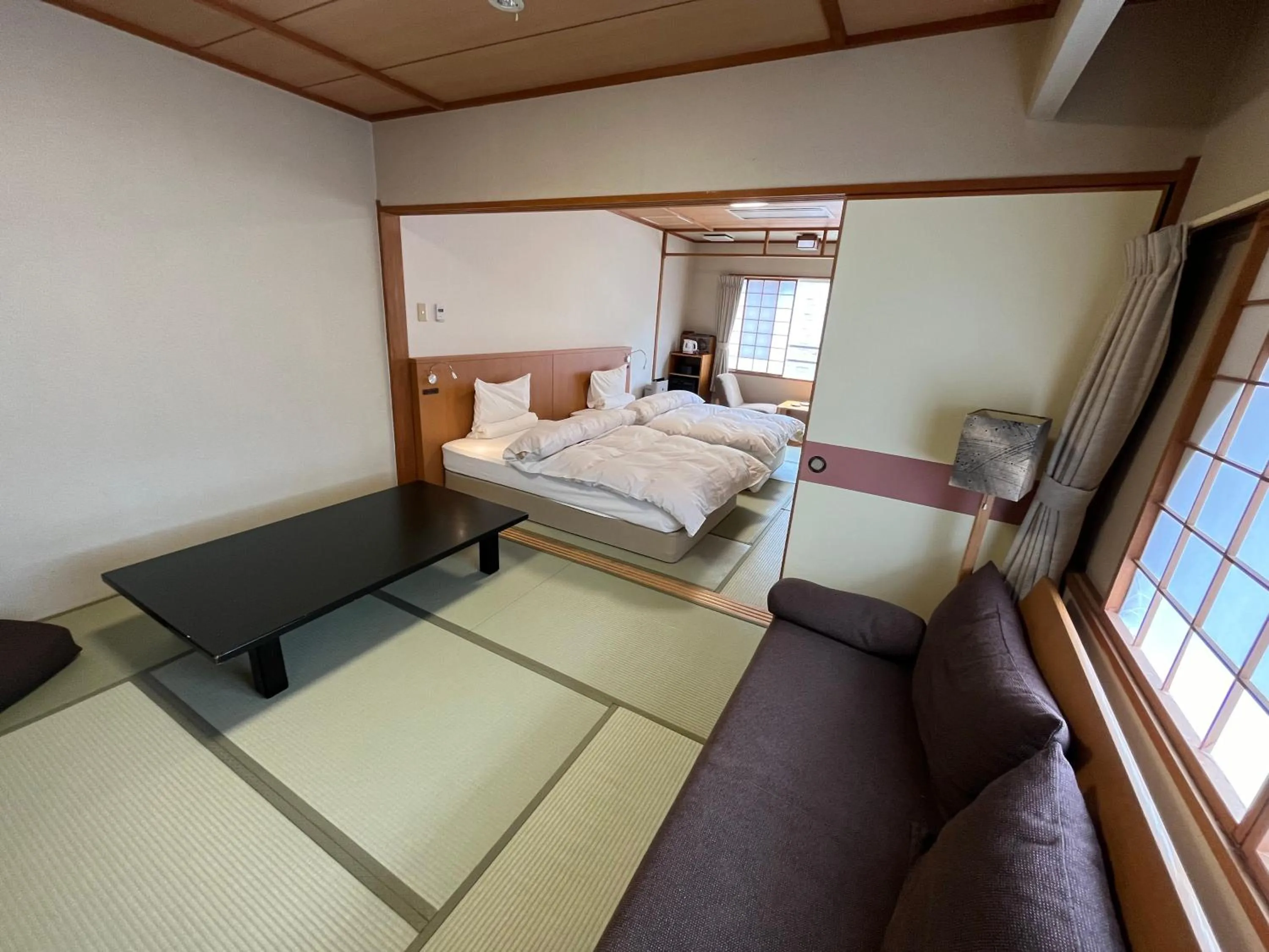 Living room, Bed in Takinoya Bekkan Tamanoyu