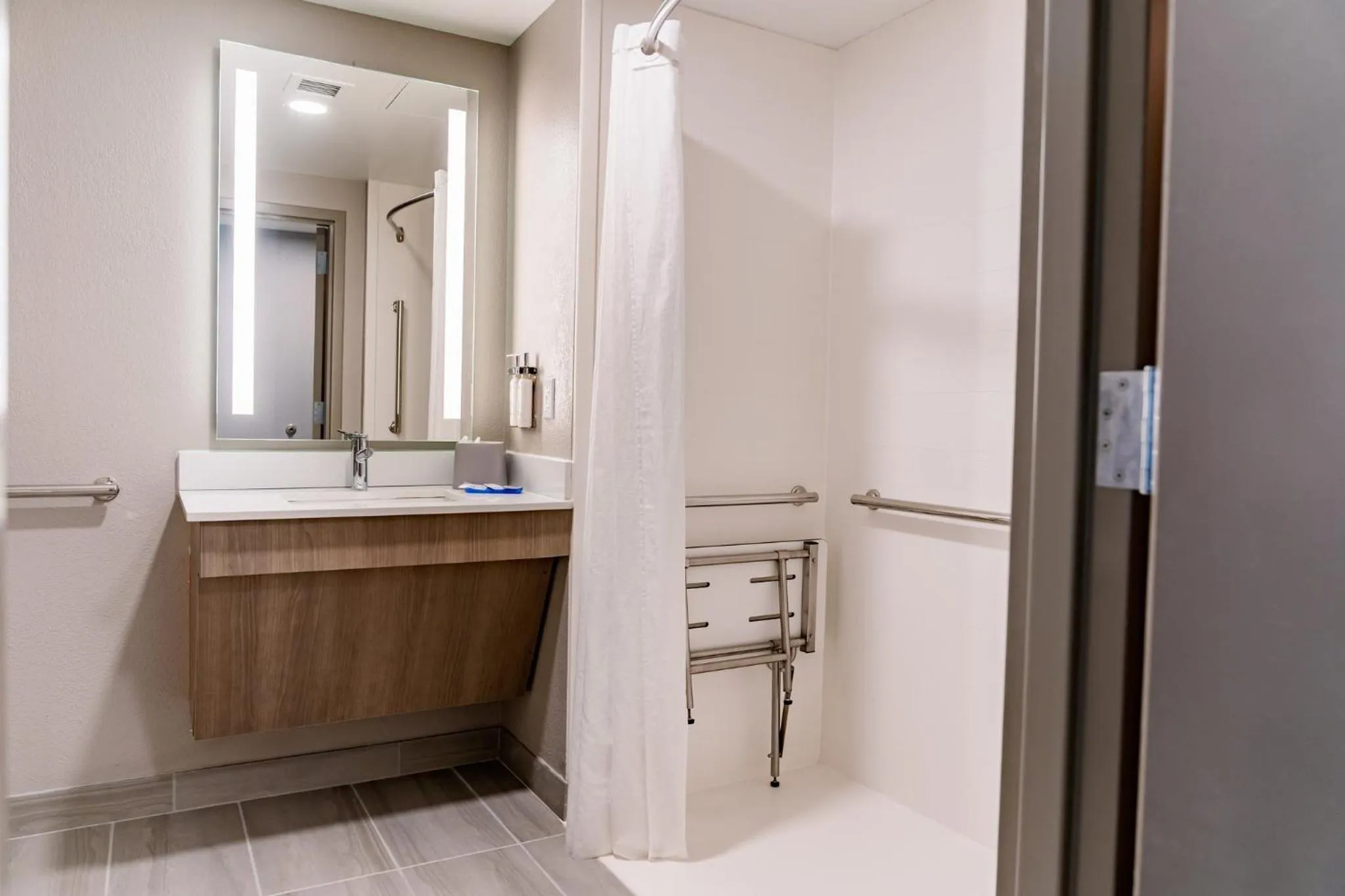 Shower in Holiday Inn Express Hotel Raleigh Southwest by IHG