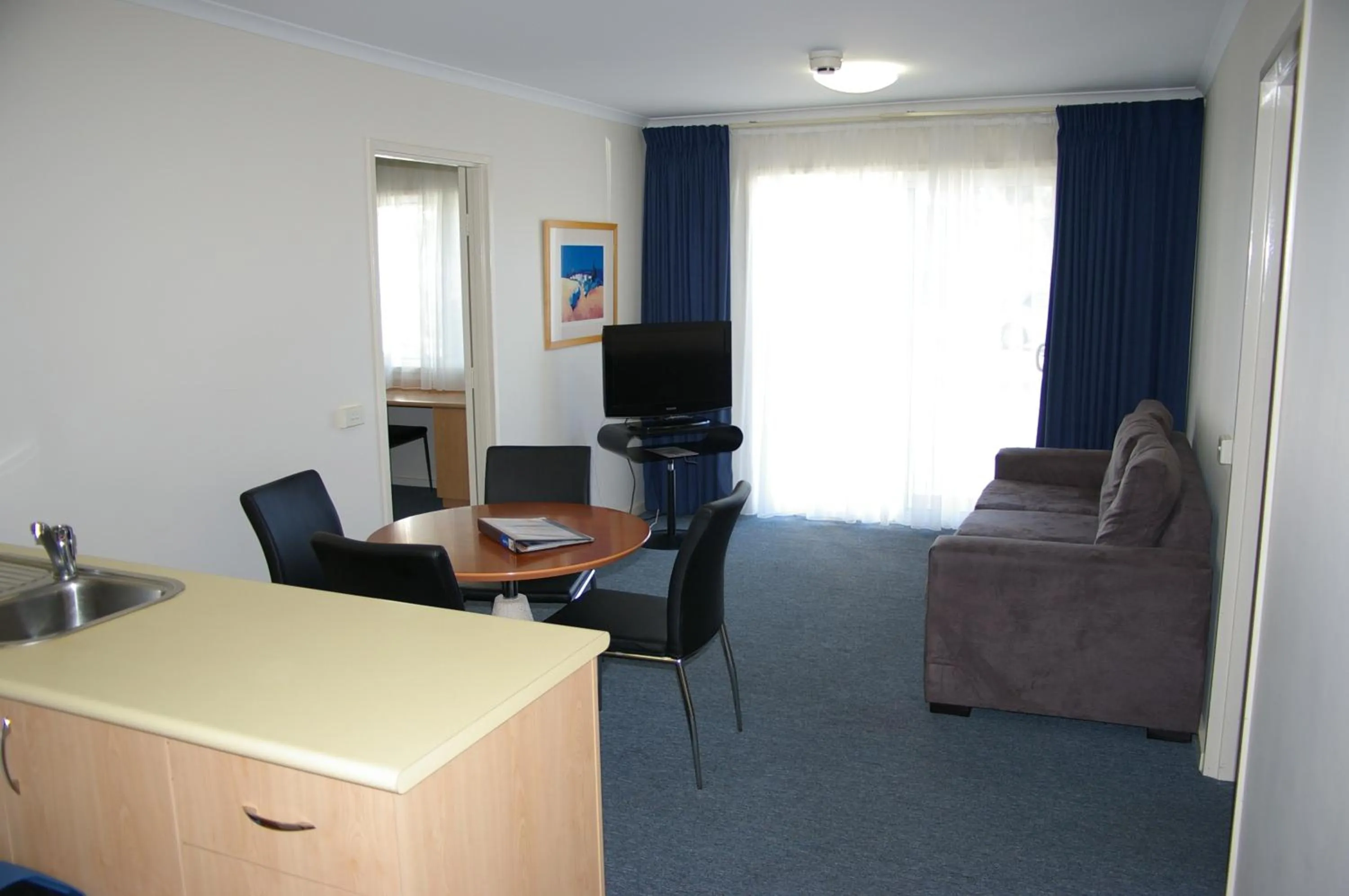 Living room in Ramada Encore by Wyndham Belconnen Canberra