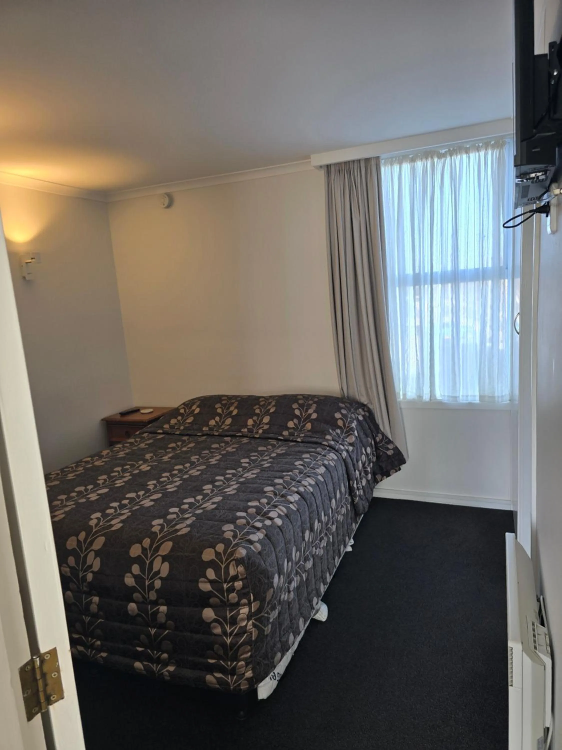 Bed in Monarch Motel