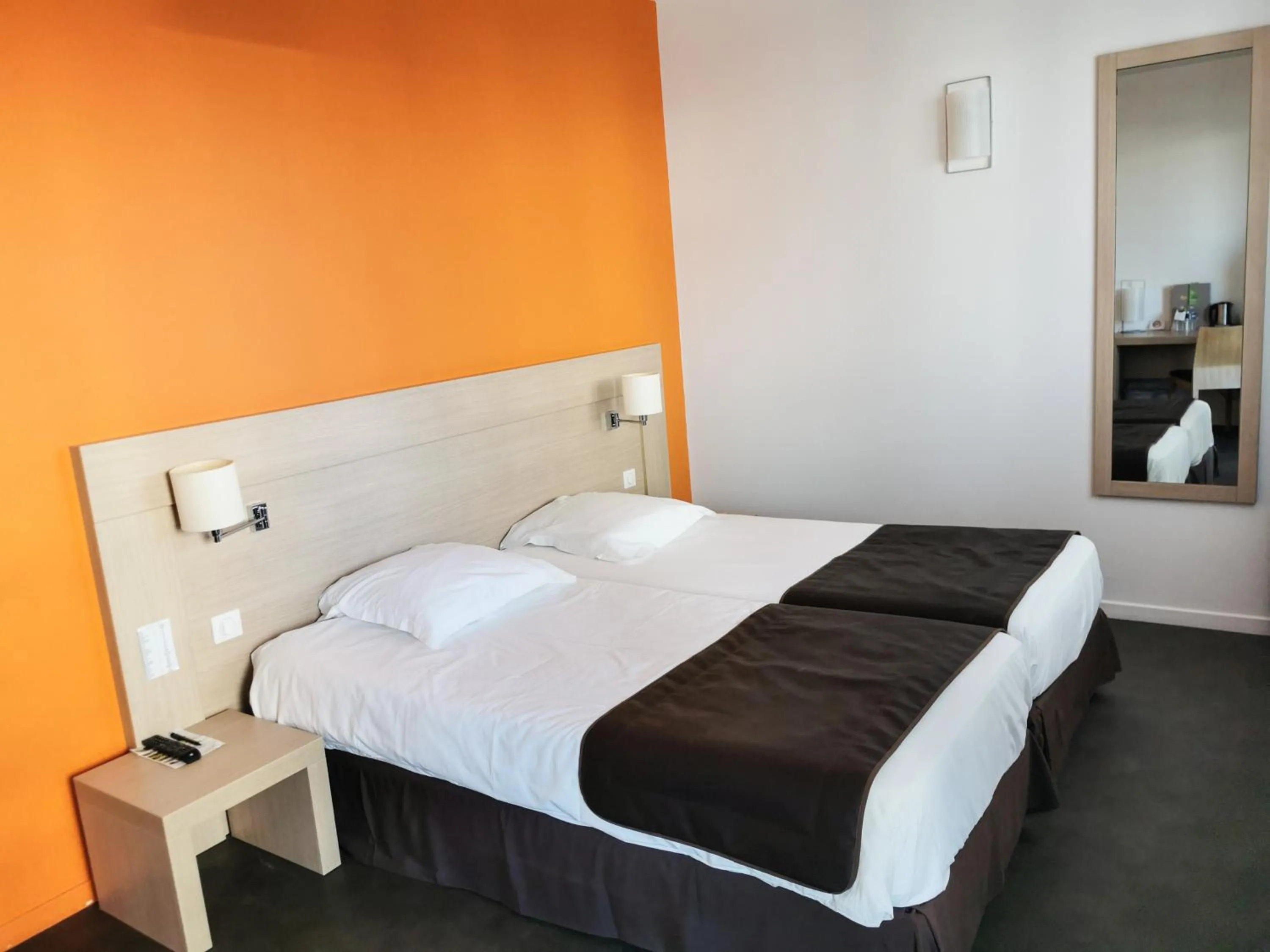 Bed in Esatitude Hotel