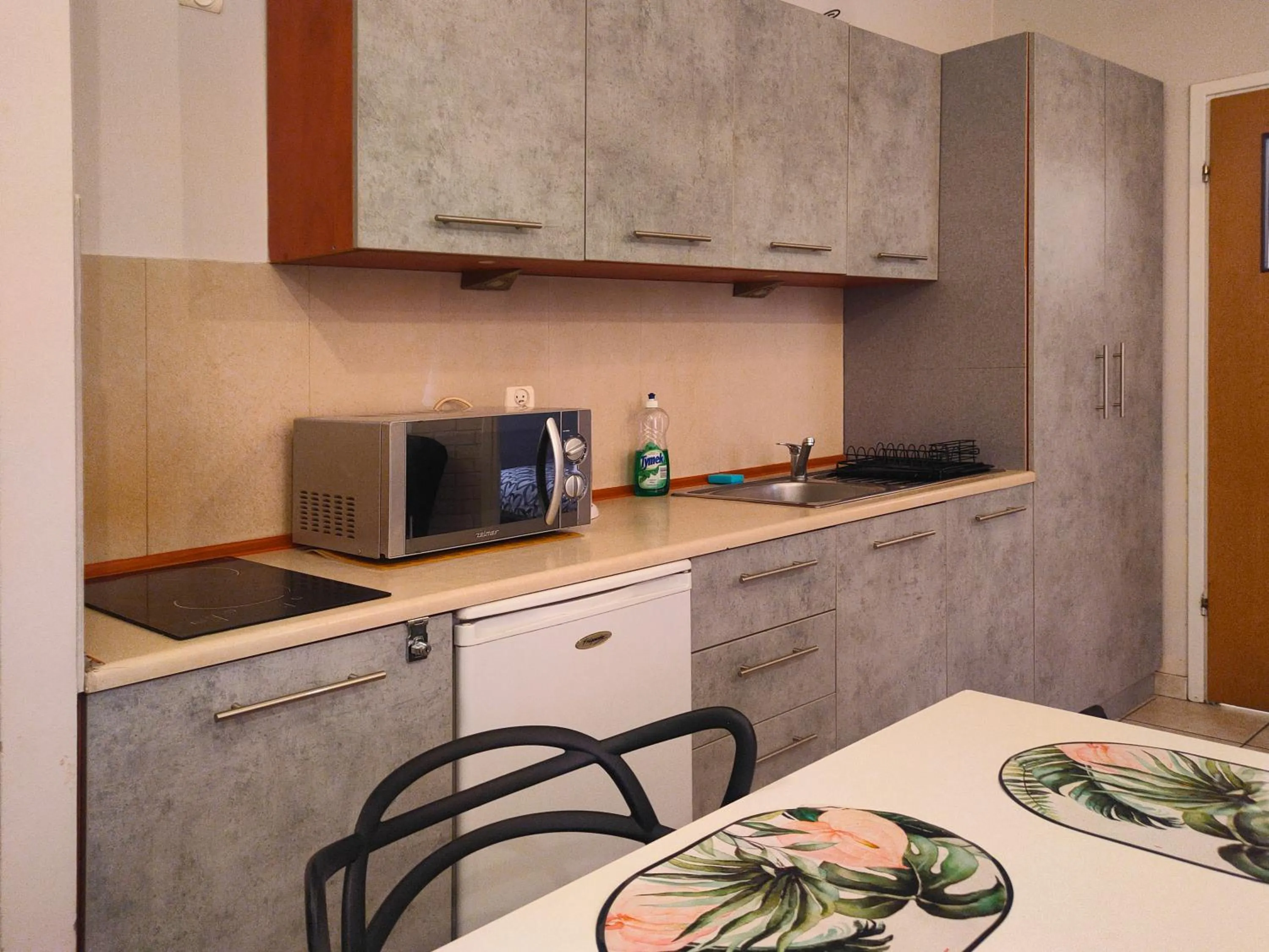 Kitchen or kitchenette in Apartamenty Amber