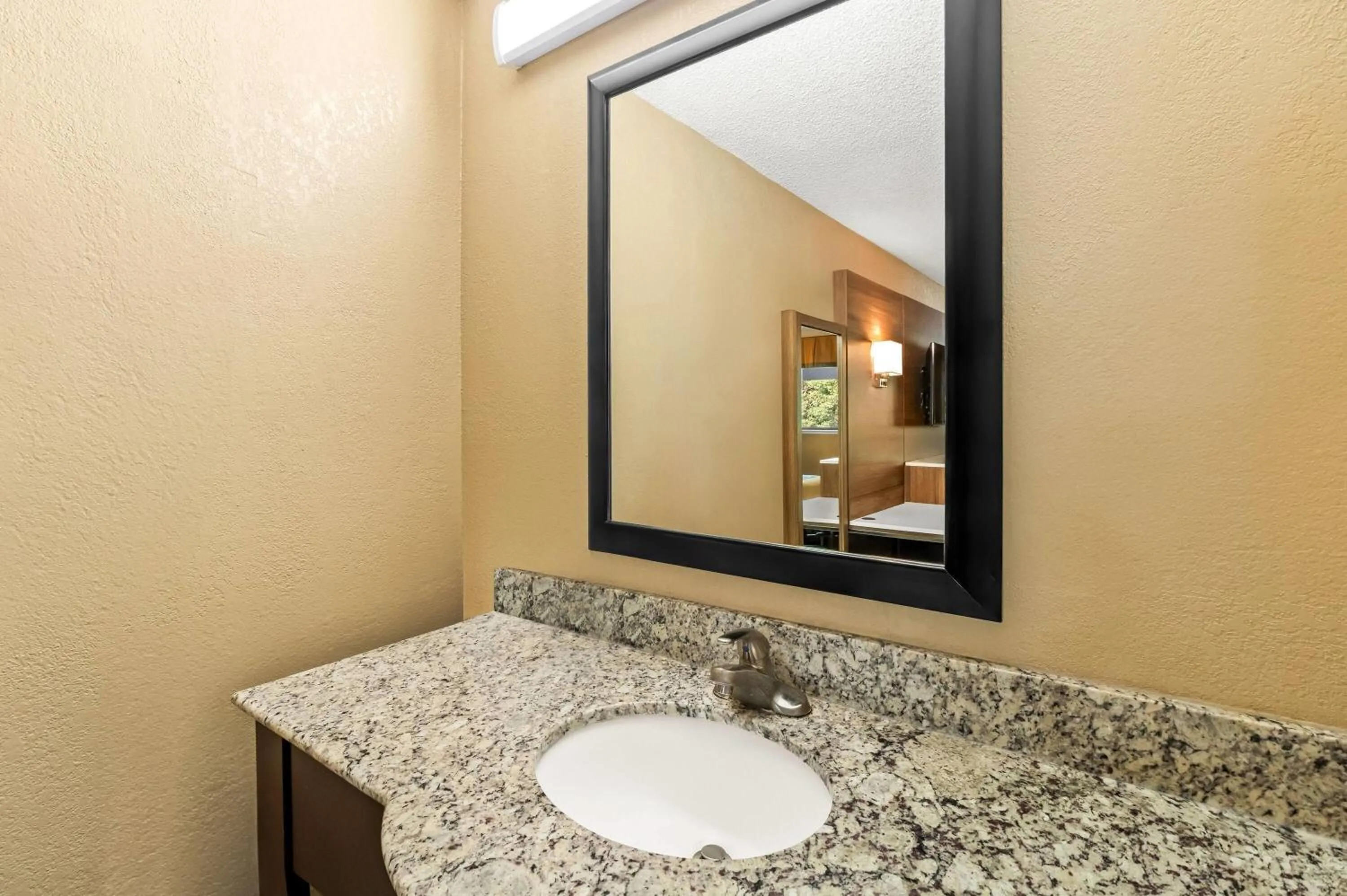 Bathroom in Super 8 by Wyndham Cincinnati-Springdale OH