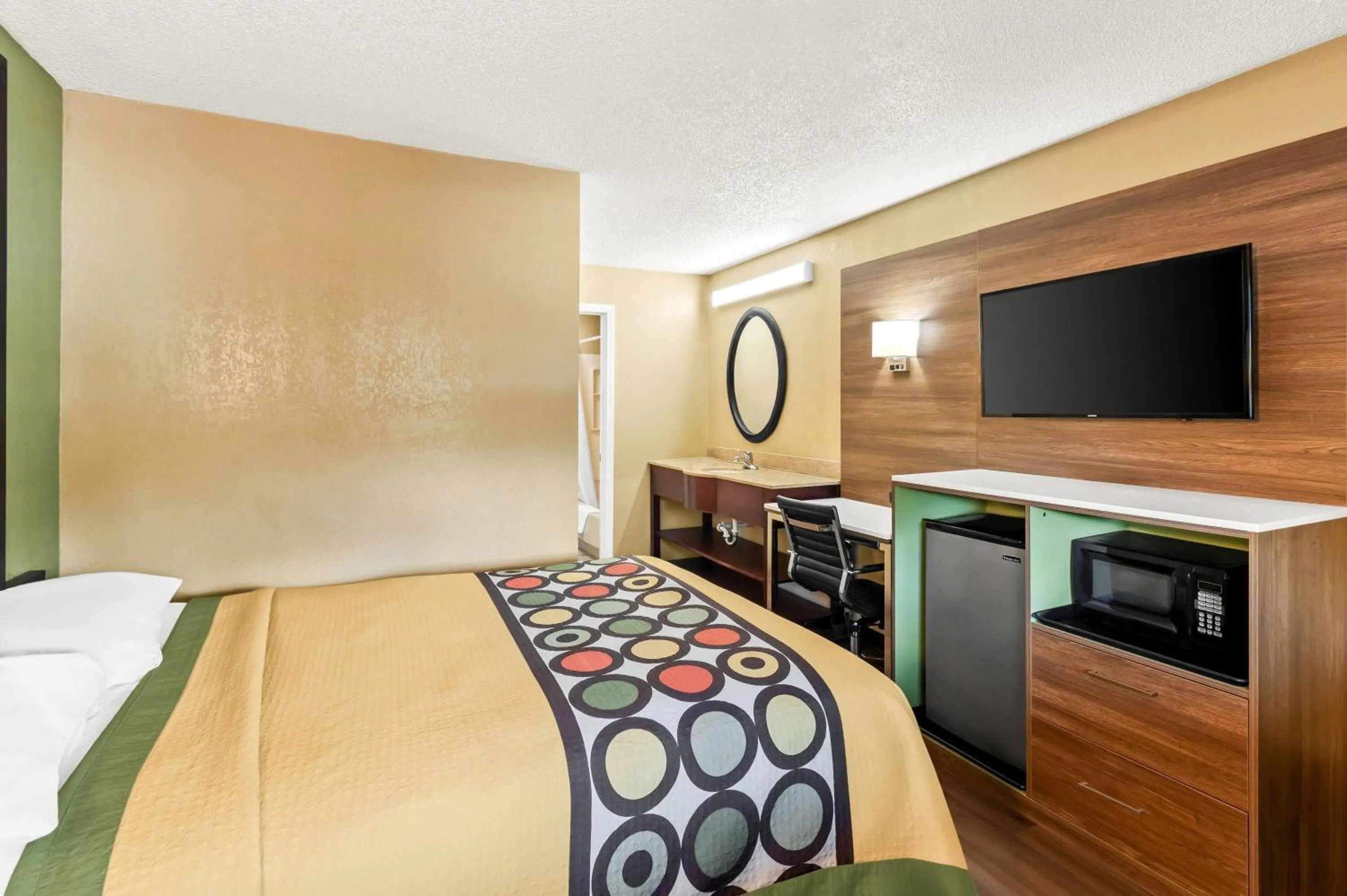 Bed in Super 8 by Wyndham Cincinnati-Springdale OH