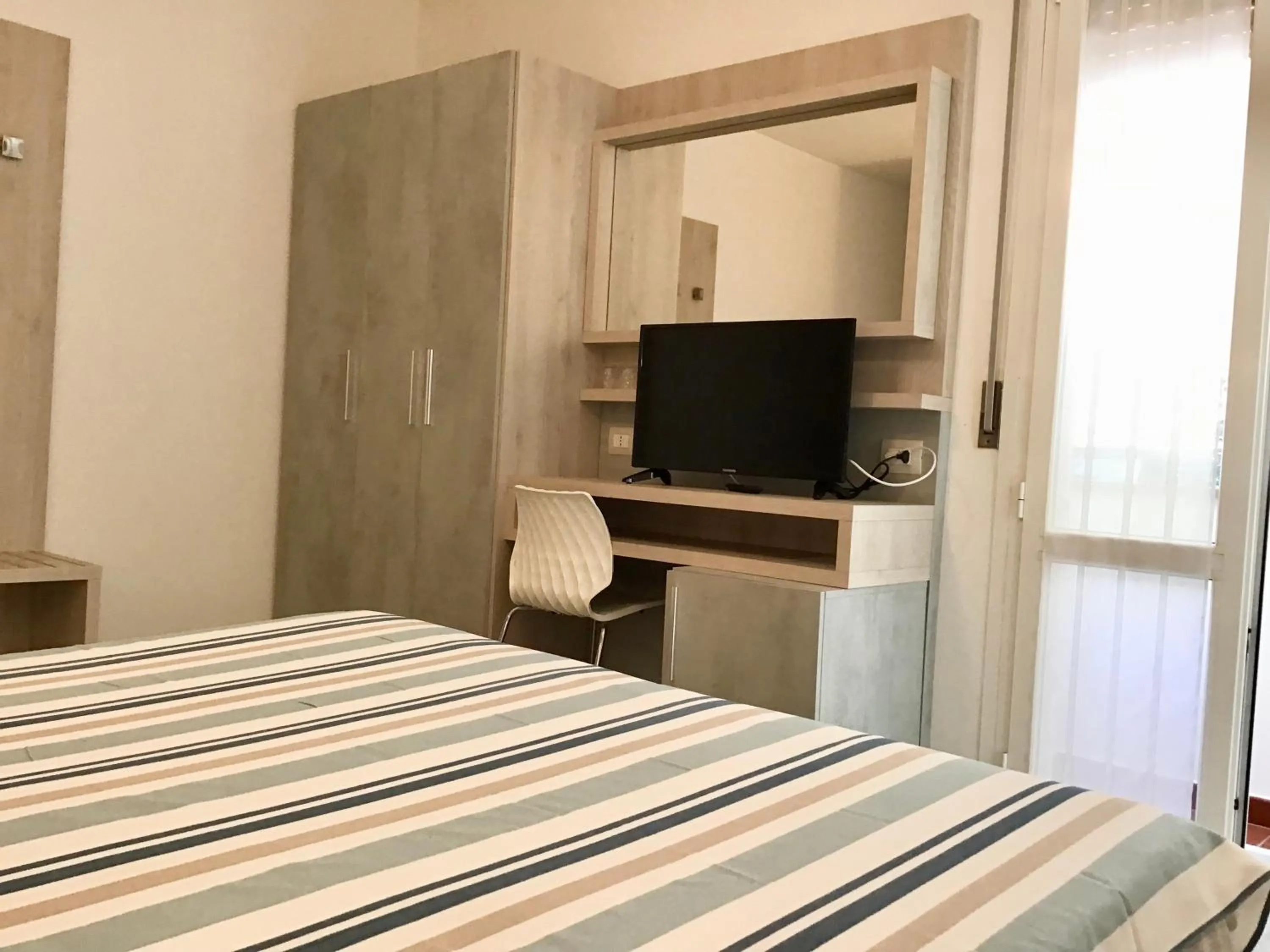 Bedroom in La Coccinella Residence