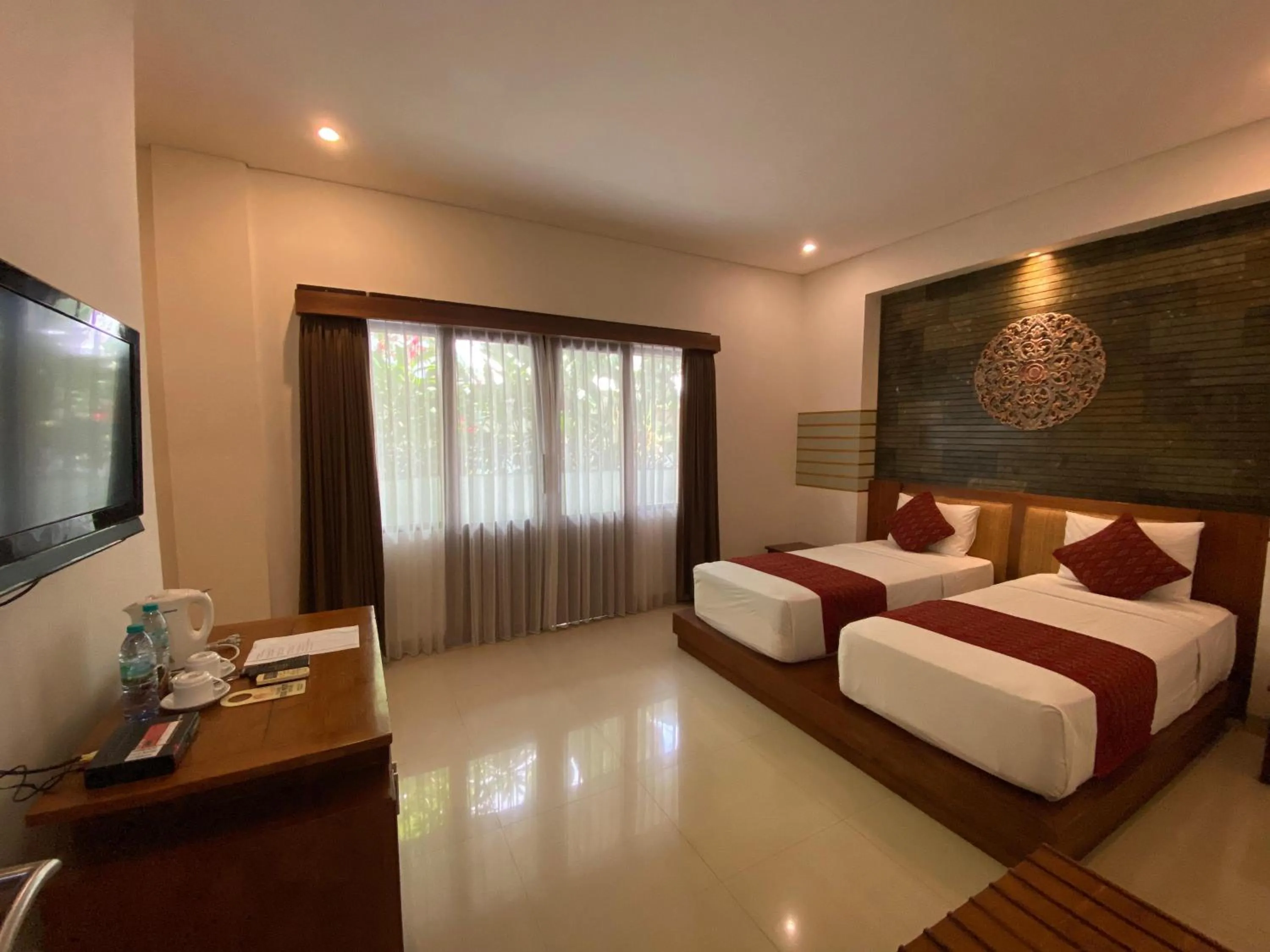 Bed in Putri Ayu Cottages