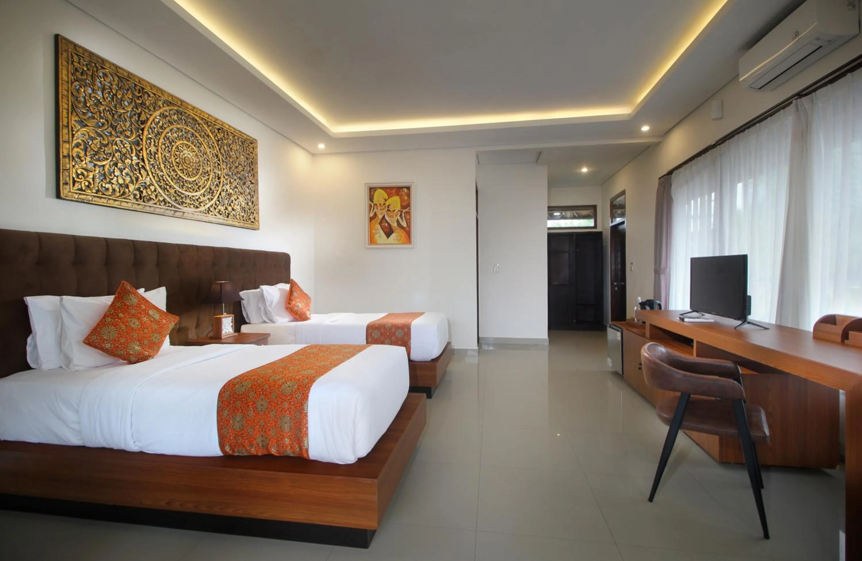 Bed in Putri Ayu Cottages