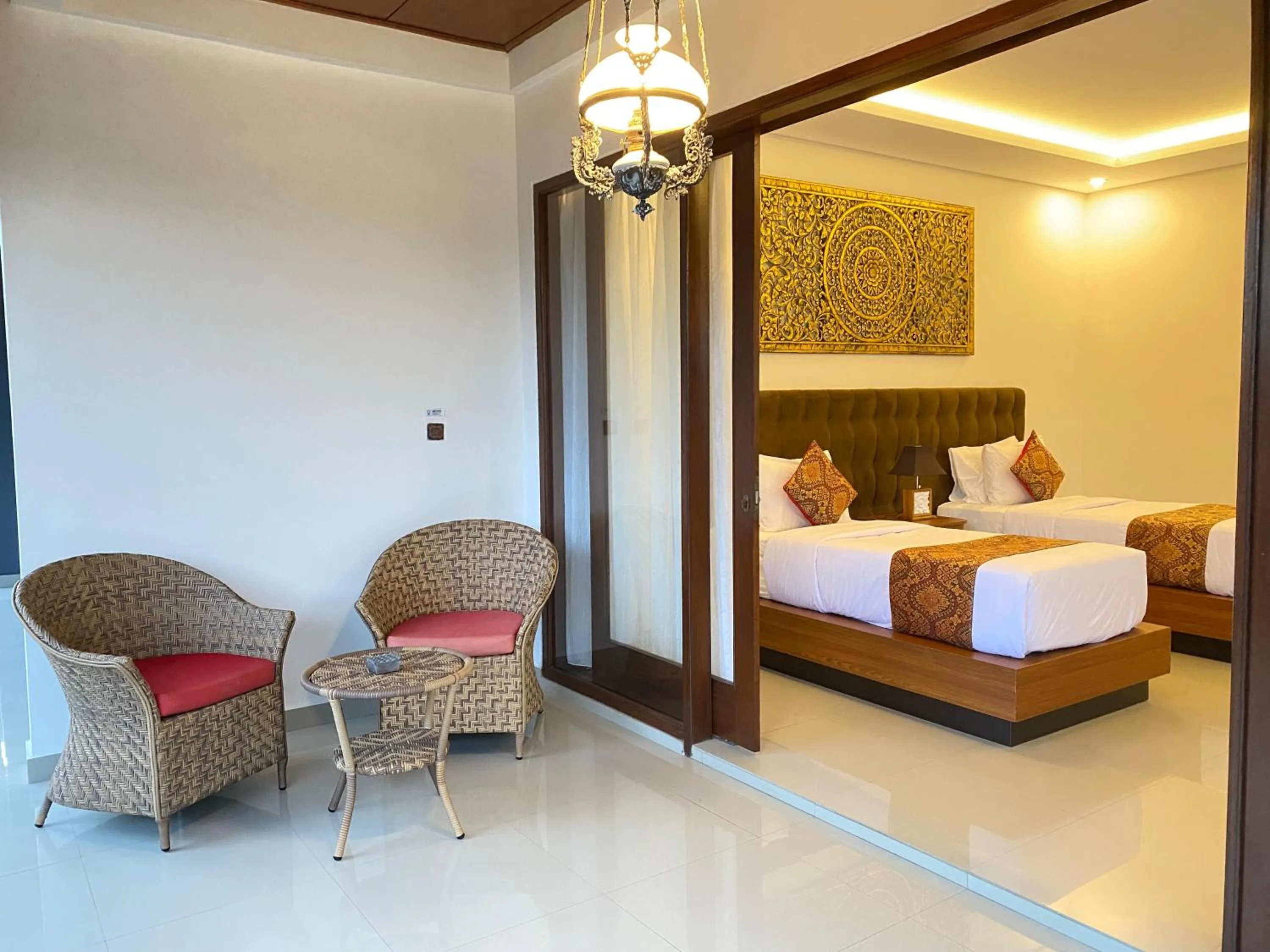 Bed in Putri Ayu Cottages