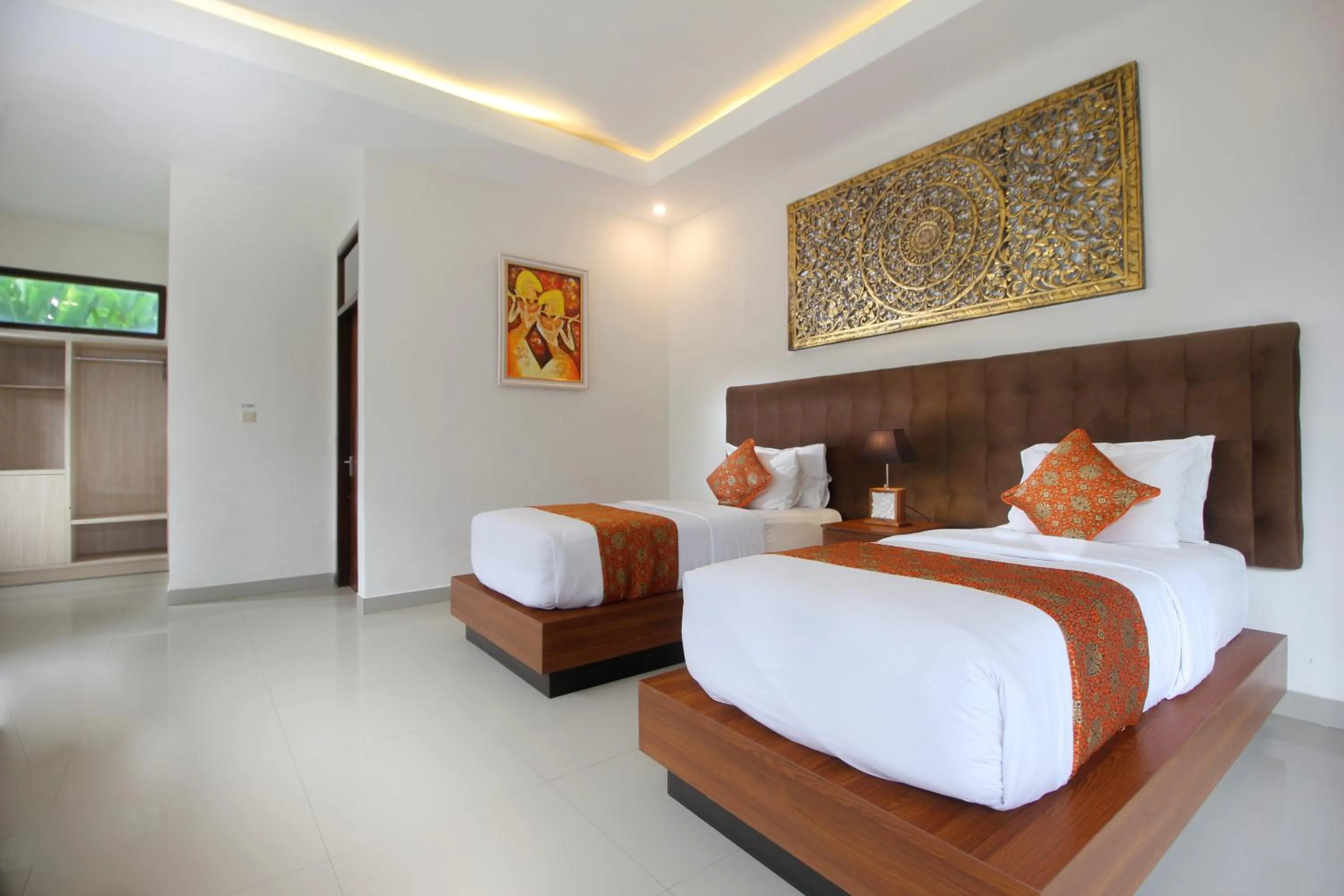 Bed in Putri Ayu Cottages