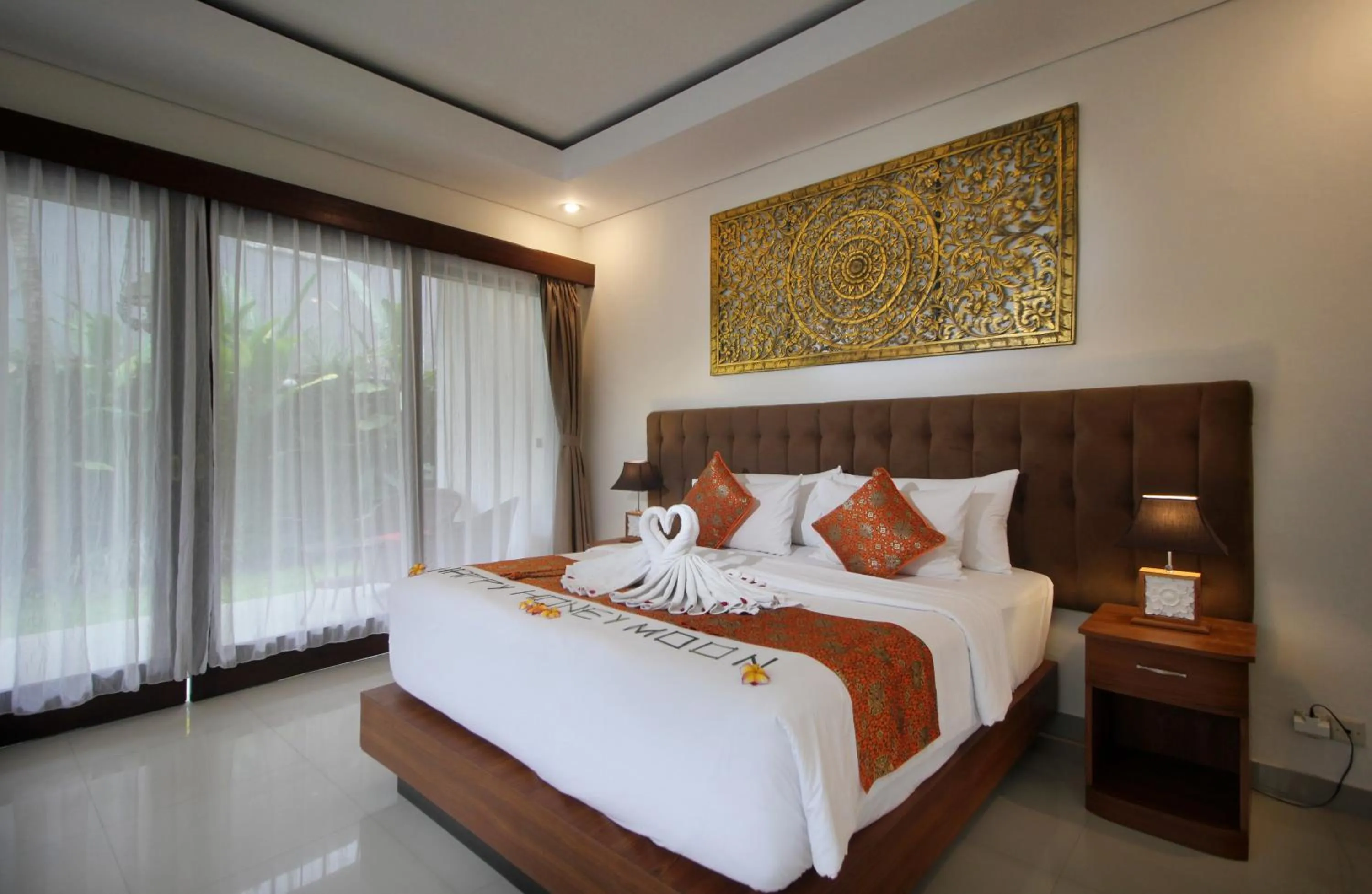 Bed in Putri Ayu Cottages