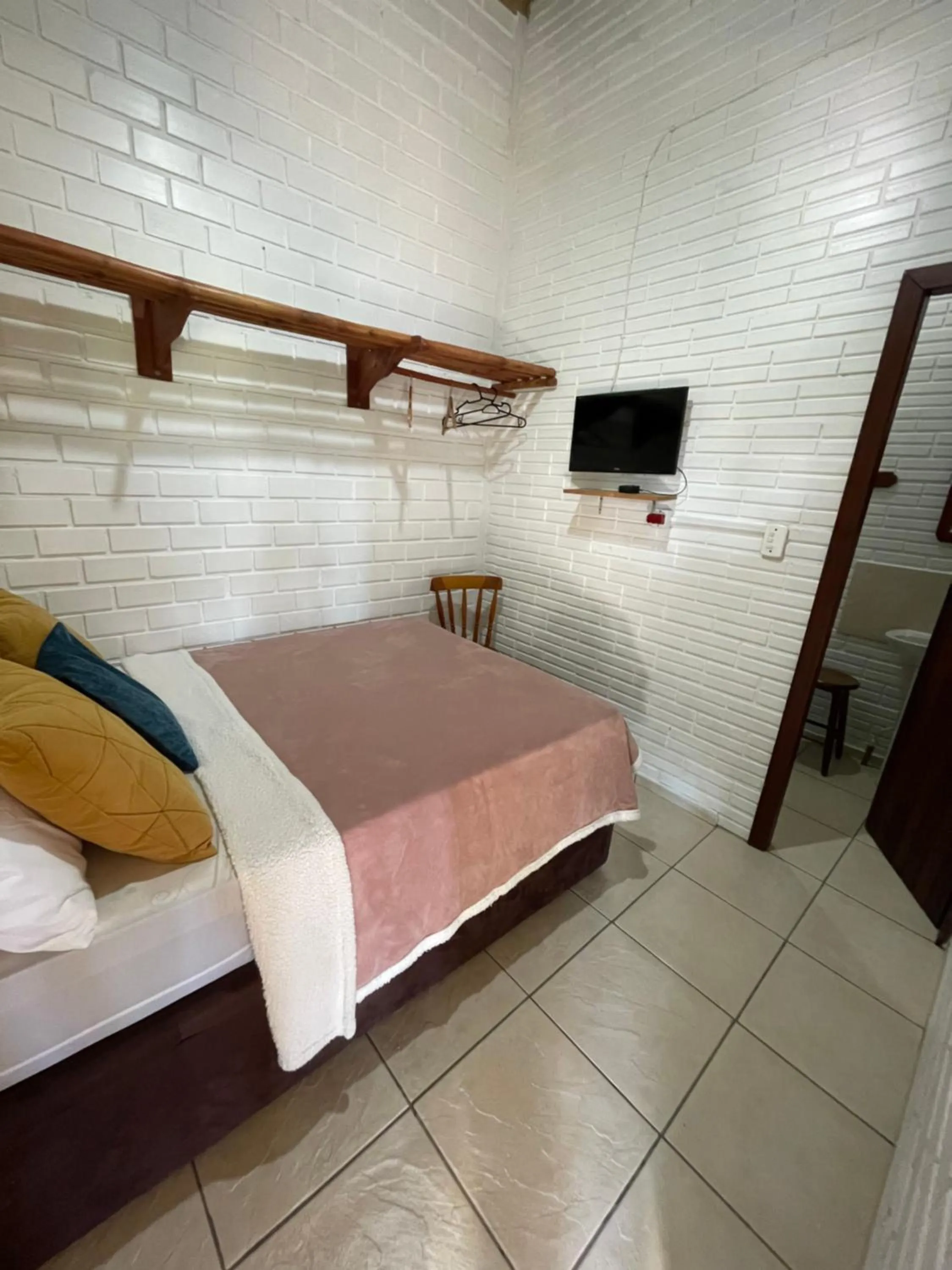 Bed in Pousada Areias do Embaú